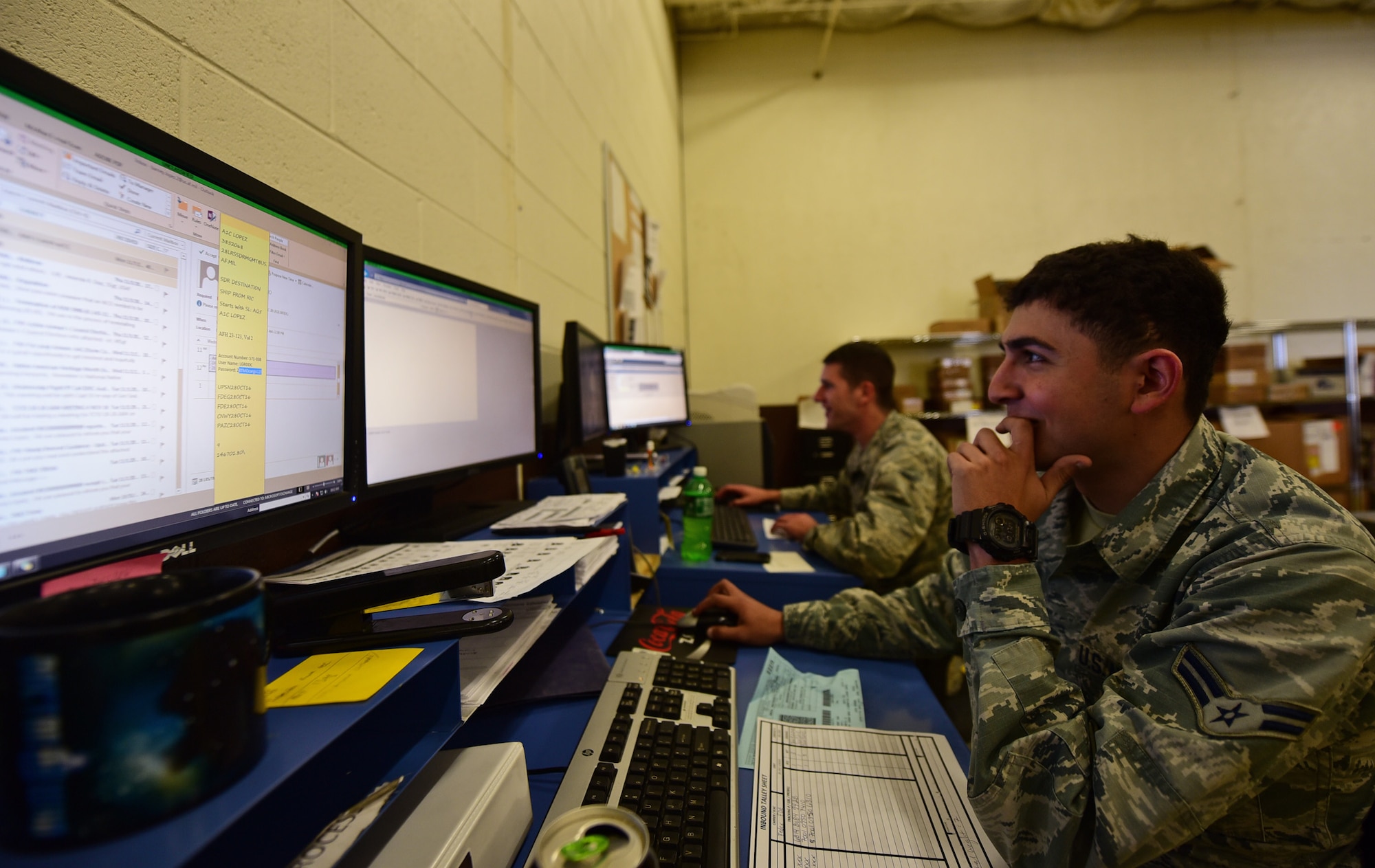 Airman 1st Class Barney Lopez and Airman Jordan Dean, traffic management apprentices assigned to the 28th Logistics Readiness Squadron, log shipments received for the day at Ellsworth Air Force Base S.D., Nov. 8, 2016. They log in shipments upon arrival to ensure the prompt delivery of products around the base. (U.S. Air Force photo by Airman 1st Class James L. Miller)