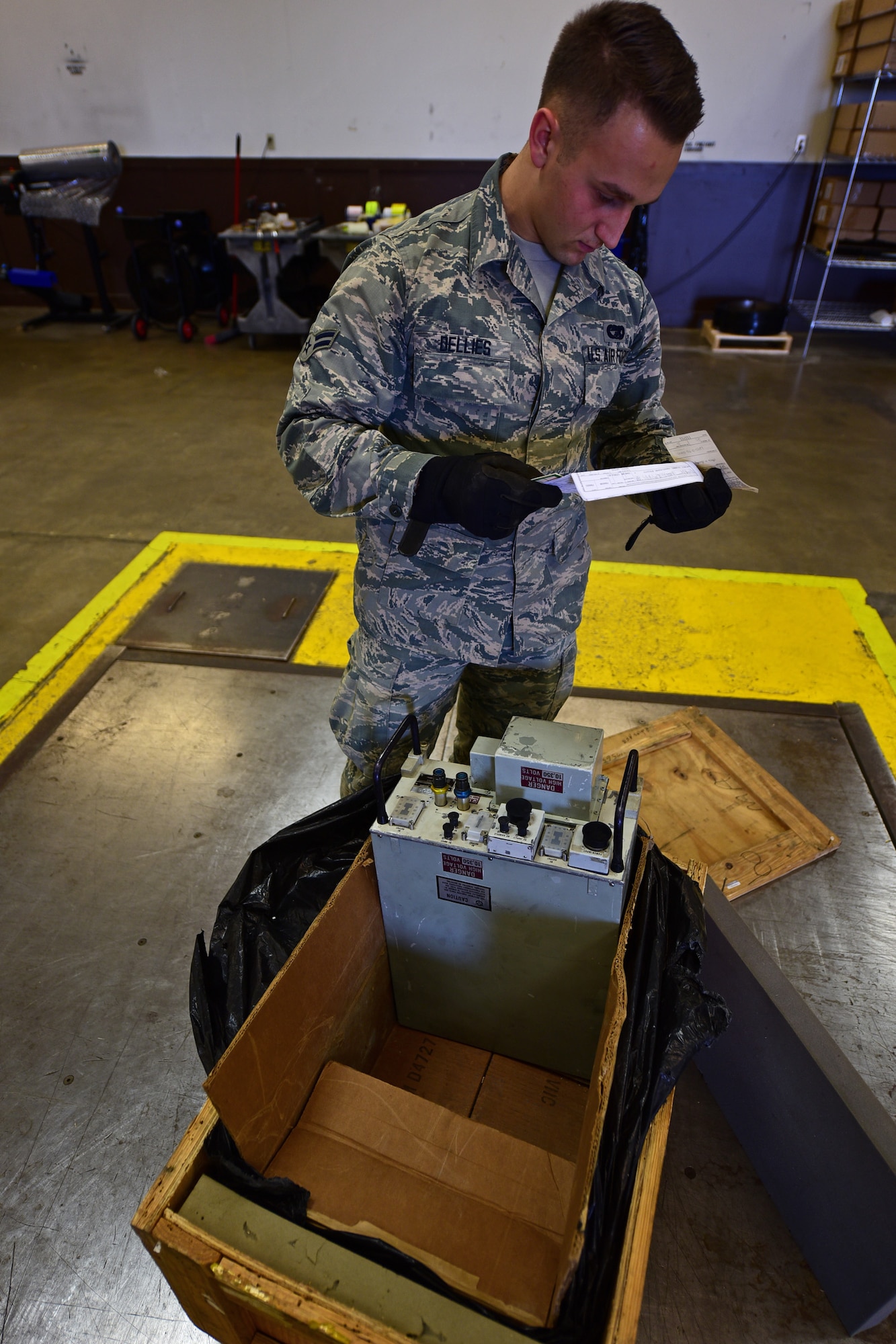 Airman 1st Class James Dellies, a traffic management journeyman assigned to the 28th Logistics Readiness Squadron, checks the packing instructions for a radio transmitter at Ellsworth Air Force Base, S.D., Nov. 8, 2016. The Traffic Management Office is responsible for the entire process of shipping, from packing to labeling. (U.S. Air Force photo by Airman 1st Class James L. Miller)