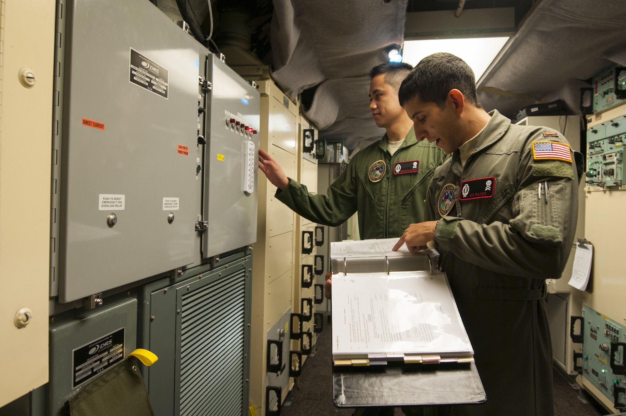 Second Lt. Nikolas Ramos, 320th Missile Squadron deputy missile combat crew commander, reads a checklist while 1st Lt. Terrence Dale Duarte, missile combat crew commander complies with the instructions in a launch control center at F.E. Warren Air Force Base, Wyo., Nov. 5, 2016. The 90th Missile Wing sustains 150 Minuteman III ICBMs and the associated launch facilities that cover 9,600 square miles across three states. (U.S. Air Force photo by Staff Sgt. Christopher Ruano)