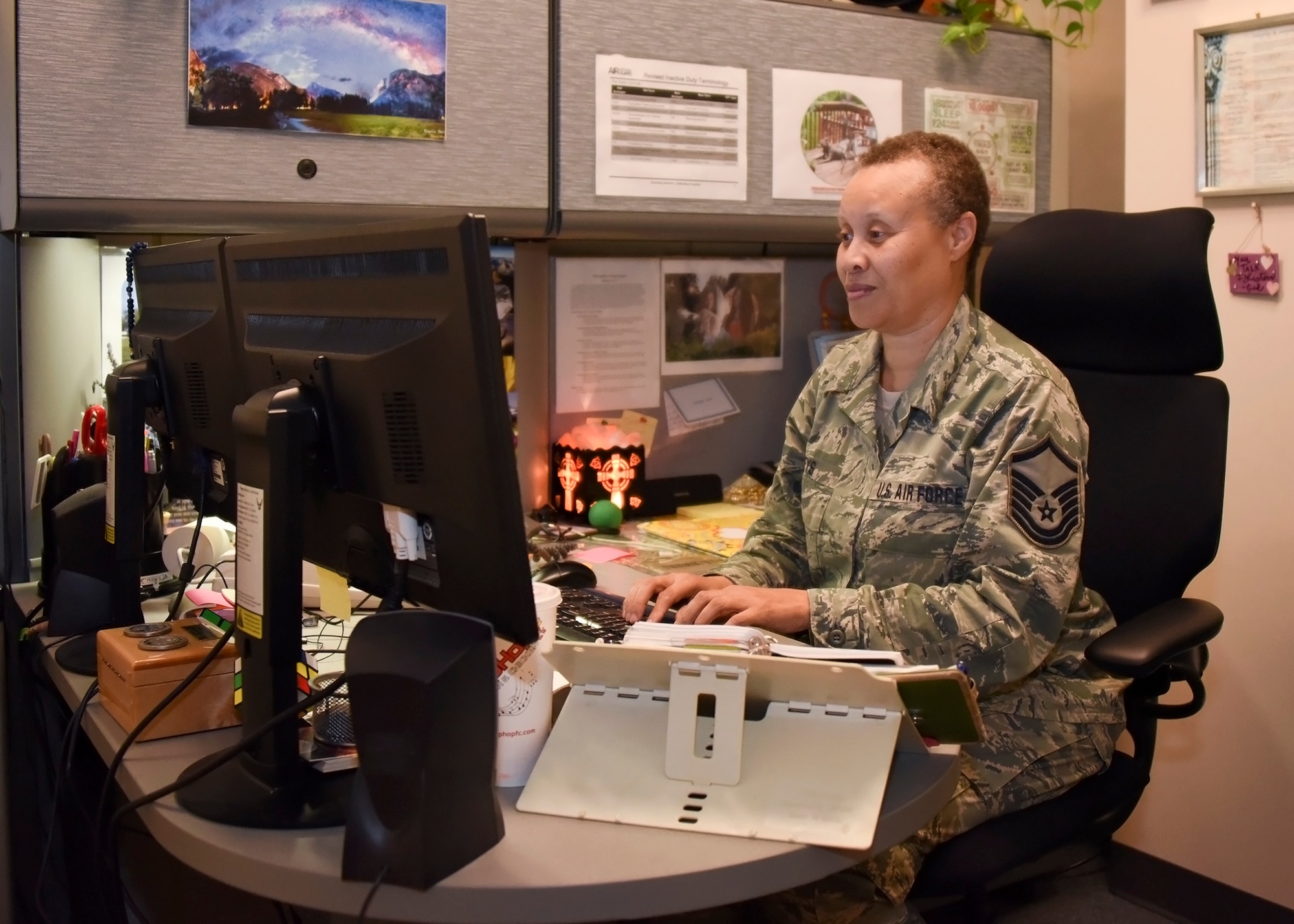 MSgt. Angela Keys is at her desk completing required reports Oct. 20, 2016 at Warfield Air National Guard Base, Middle River, Md. Keys is currently the base services manager. (U.S. Air National Guard photo by Airman 1st Class Enjoli Saunders/RELEASED)