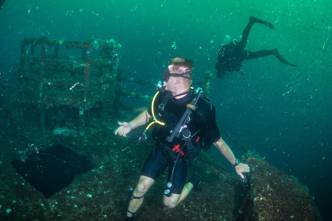 Navy Petty Officer 2nd Class Alec Stuller scuba dives near the HMAS Adelaide shipwreck during Exercise Dugong in Sydney, Australia, Nov. 14, 2016. The training exercise advances interoperability between the U.S and Australian navies. Navy photo by Petty Officer 1st Class Arthurgwain L. Marquez