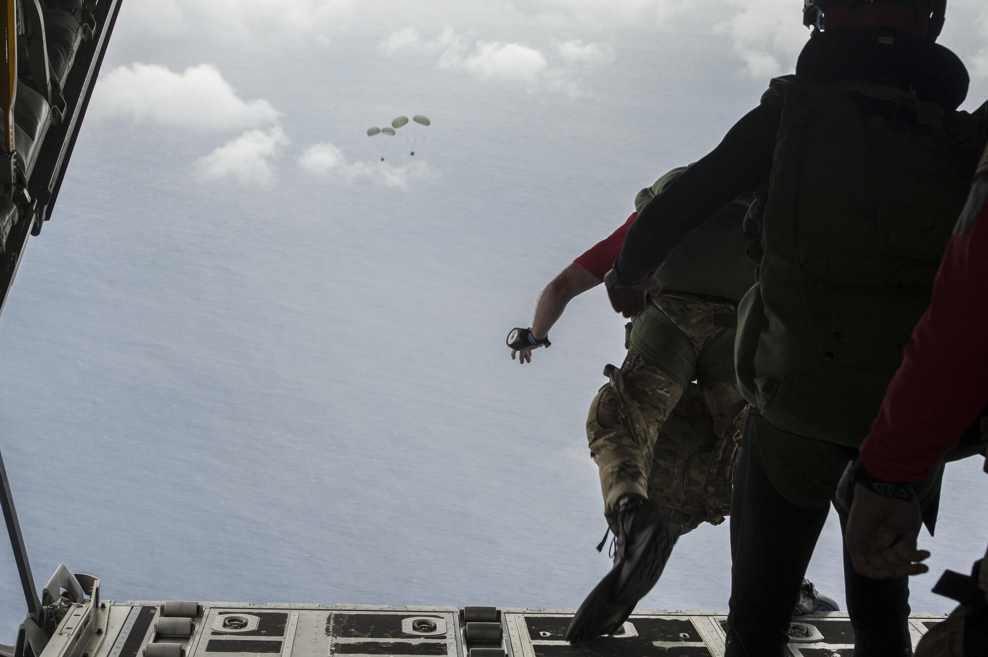U.S Air Force pararescuemen from the 31st Rescue Squadron jump out of an MC-130J Commando II during Exercise Keen Sword 17 Nov. 10, 2016, off the coast of Okinawa, Japan. Exercises like Keen Sword demonstrate the ability of rescue teams to quickly gather resources and respond to a situation. (U.S. Air Force photo by Senior Airman Lynette M. Rolen/Released)