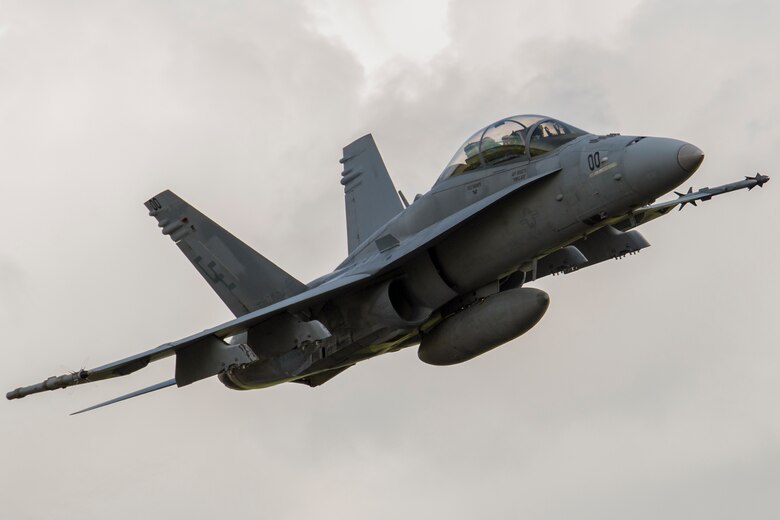 A U.S. Marine Corps F/A-18D Hornet takes off from Sam Ratulangi International Airport, Indonesia, during exercise Cope West 17, Nov. 8, 2016. This fighter-focused, bilateral exercise between the U.S. Marine Corps and Indonesian Air Force is designed to enhance the readiness of combined interoperability between the two nations. The squadron plans to complete their unit air-to-air training requirements, which focuses on basic fighter maneuvering, section engaged maneuvering, offensive anti-air warfare and active air defense versus the Indonesian Air Force to increase situational readiness, interoperability, knowledge and partnership between the U.S. and Indonesia. (U.S. Marine Corps photo by Cpl. Aaron Henson)