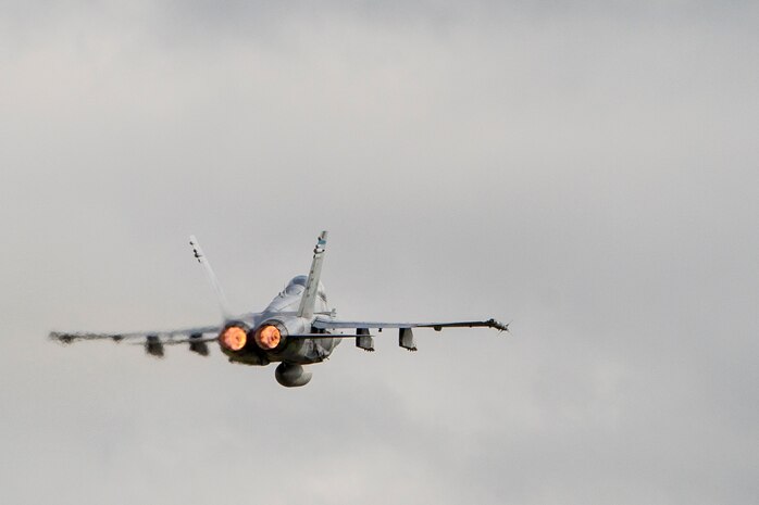 A U.S. Marine Corps F/A-18D Hornet takes off from Sam Ratulangi International Airport, Indonesia during exercise Cope West 17, Nov. 8, 2016. The combined training offered by this exercise helps prepare the U.S. Marine Corps and Indonesia Air Force to work together in promoting a peaceful Indo-Asia-Pacific region while practicing close air support and air-to-air training that will enhance their to respond to contingencies throughout the region. Both the U.S. F/A-18D Hornets and Indonesian F-16 Fighting Falcons bring unique capabilities affording the associated nations the opportunity to learn and understand each other’s skills, preparing them for real world contingencies and further strengthening their relationship. (U.S. Marine Corps photo by Cpl. Aaron Henson)