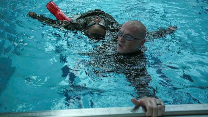 Marines perform one of four survival strokes during an advanced water survival qualification course at Camp Lejeune, N.C., Nov. 8, 2016. The course taught Marines multiple survival strokes, saving distressed victims in the water and boosted underwater confidence. 