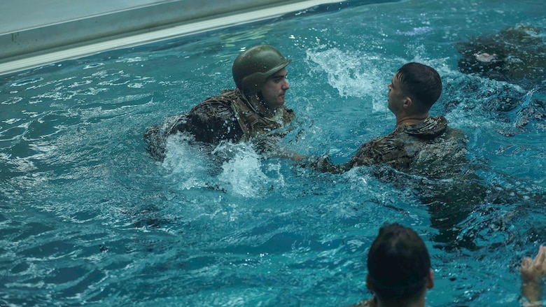 Marines practice rescuing notional victims with full combat gear during an advanced water survival qualification course at Camp Lejeune, N.C., Nov. 8, 2016. “The survival strokes are for efficiency, not speed,” said Sgt. Sasha McFadden, a Marine Combat Instructor of Water Survival Instructor with 2nd Radio Battalion. 