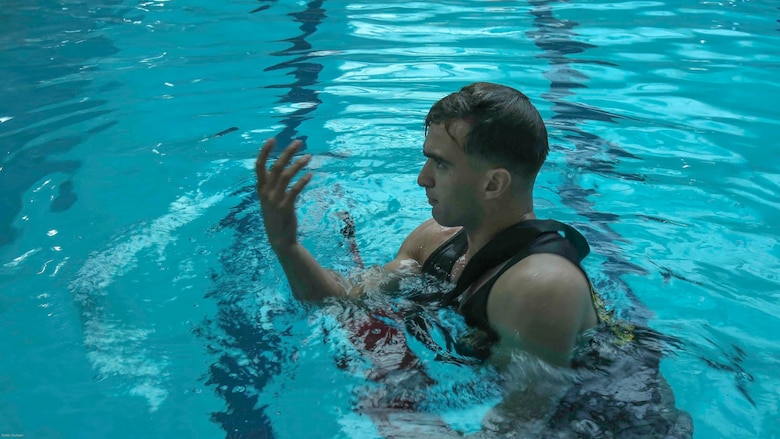Sgt. Sasha McFadden shows Marines exactly how to perform a certain buddy rescue during an advanced water survival course at Marine Corps Base Camp Lejeune, N.C., Nov. 8, 2016. The Marines learned survival strokes, saving distressed victims and underwater confidence. 