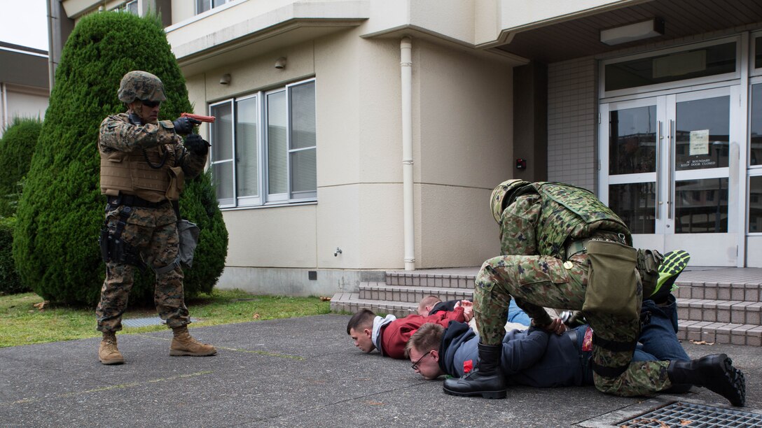 U.S. Marines and Japan Ground Self-Defense Force members executed exercise Active Shield at Marine Corps Air Station Iwakuni, Japan, Nov. 10, 2016. Active Shield is an annual exercise designed to test the abilities of U.S. and Japanese forces to work alongside each other to protect and defend Marine Corps Air Station Iwakuni and other U.S. assets in the region. 