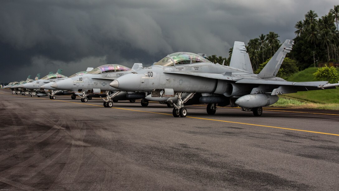 U.S. Marine Corps F/A-18D Hornets with Marine All-Weather Fighter Attack Squadron 225 and Indonesian F-16 Fighting Falcons sit on the flight line during exercise Cope West 17 at Sam Ratulangi International Airport, Indonesia, Nov. 10, 2016. This fighter-focused, bilateral exercise between the U.S. Marine Corps and Indonesian Air Force is designed to enhance the readiness of combined interoperability between the two nations. 