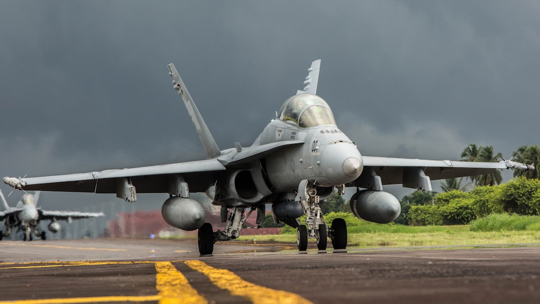 A U.S. Marine Corps F/A-18D Hornet with Marine All-Weather Fighter Attack Squadron 225 taxis down the flight line during exercise Cope West 17 at Sam Ratulangi International Airport, Indonesia, Nov. 10, 2016. This fighter-focused, bilateral exercise between the U.S. Marine Corps and Indonesian Air Force is designed to enhance the readiness of combined interoperability between the two nations. 