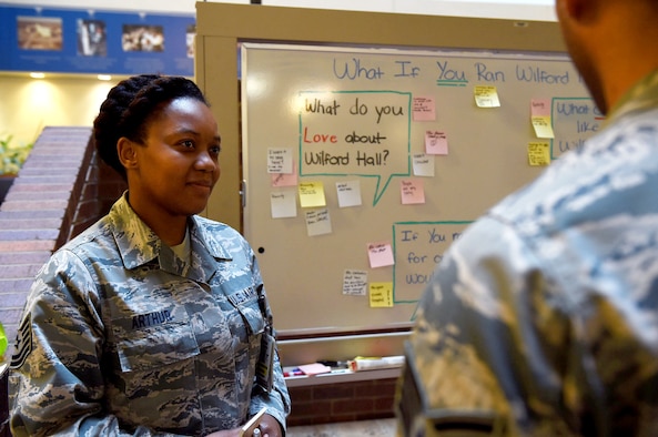 Tech. Sgt. Vanessa Arthur, 59th Medical Wing Gateway Innovation Center NCO in charge, listens to patient at the Wilford Hall Ambulatory Surgical Center atrium on Joint Base San Antonio-Lackland, Nov. 9, 2016. The wing’s Gateway Innovation team started the three-day campaign in an effort to solicit feedback directly from patients. (U.S. Air Force photo/Staff Sgt. Jerilyn Quintanilla)