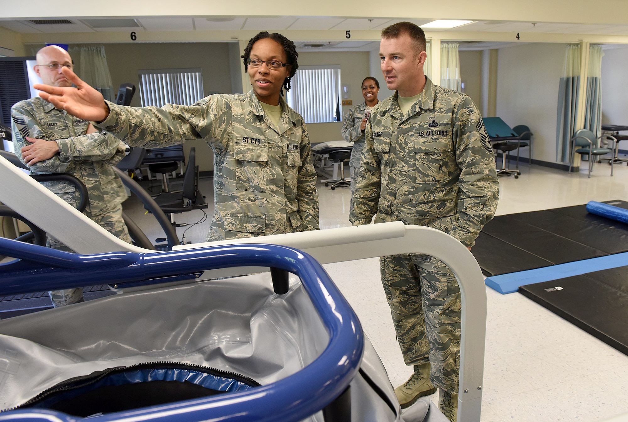 Senior Airman Jessica St. Cyr, 78th Medical Group physical therapist, guides Chief Master Sgt. Gary Sharp, Air Force Sustainment Center command chief, through the unit’s physical therapy section during a recent visit to Robins Air Force Base, Ga.  (U.S. Air Force photos by Tommie Horton