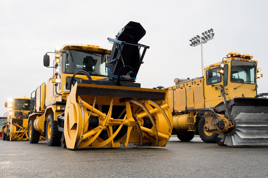 Snow removal vehicles belonging to the 436th Civil Engineer Squadron sit idle on the flightline prior to the annual snow parade Nov. 9, 2016, on Dover Air Force Base, Del. The snow parade is held to ensure staff members and equipment are ready for the coming winter season and to familiarize unit commanders with the snow removal process. (U.S. Air Force photo by Mauricio Campino)