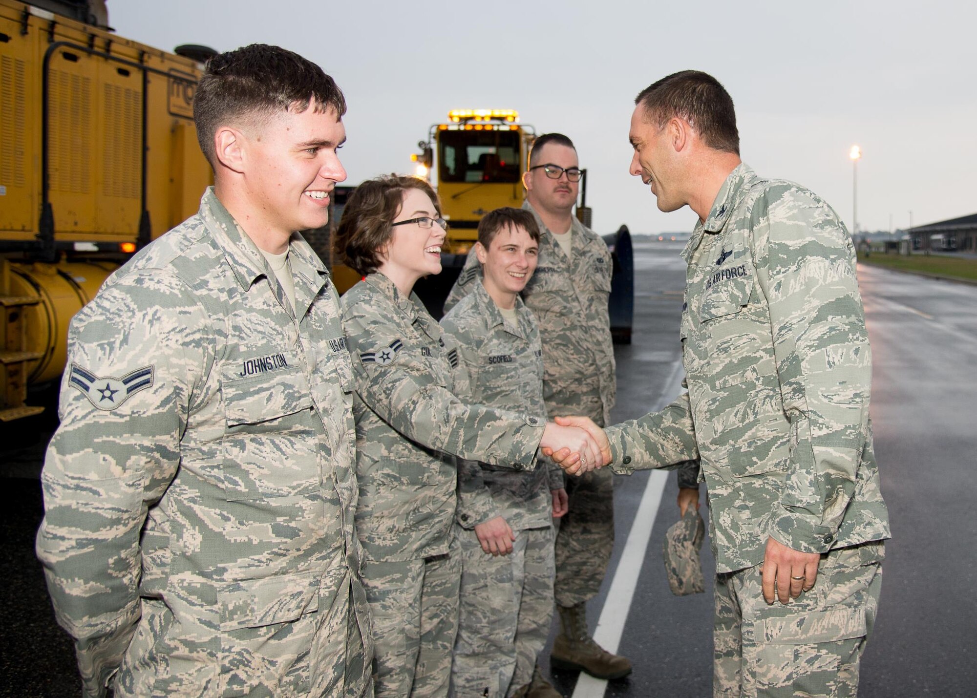Col. Ethan Griffin, 436th Airlift Wing commander, meets 436th Operations Support Squadron Airmen prior to the snow parade Nov. 9, 2016, on Dover Air Force Base, Del. Unit leaders were given the opportunity to ride in or drive snow removal vehicles to familiarize themselves with the snow removal process. (U.S. Air Force photo by Mauricio Campino)