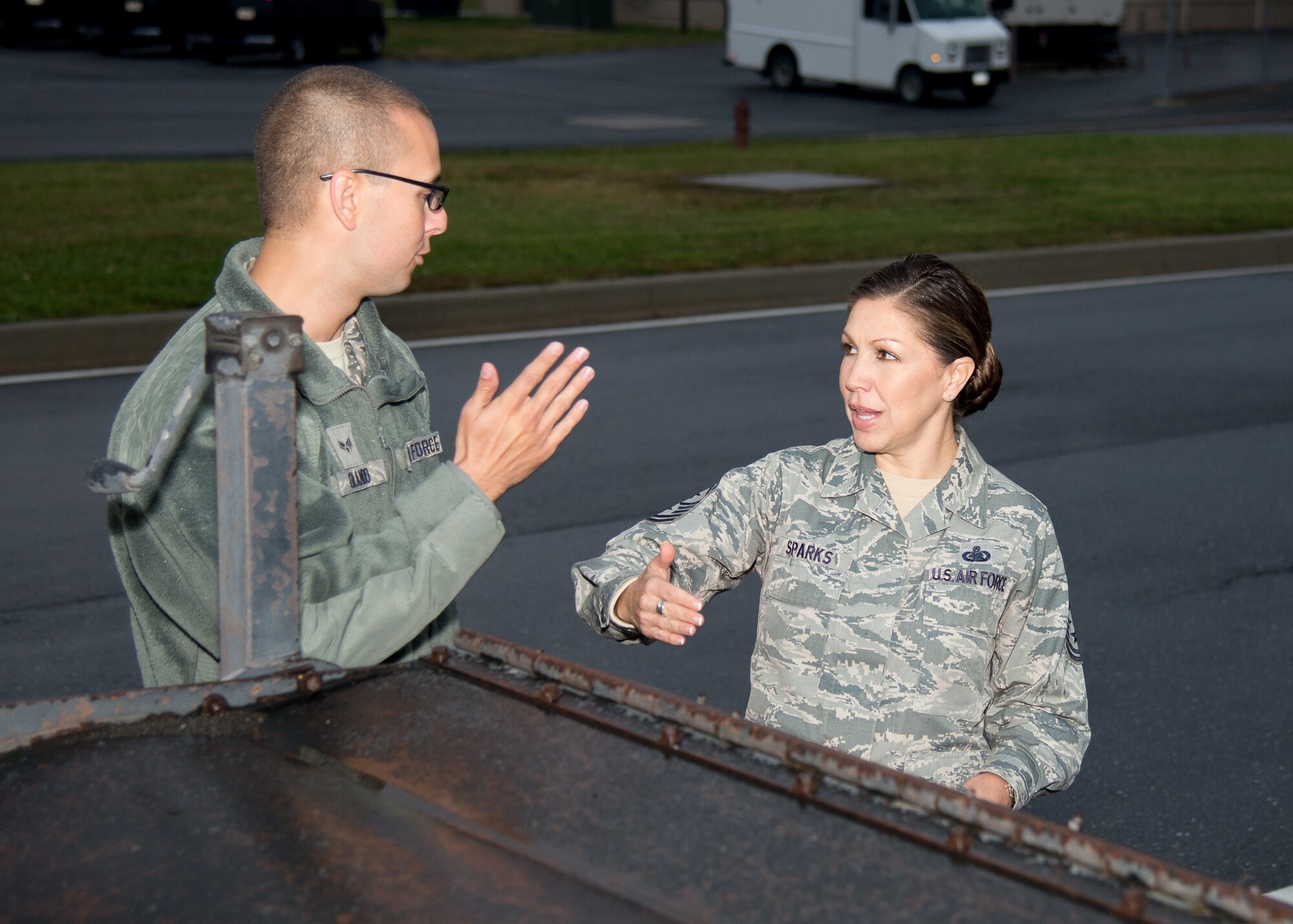 Senior Airman Joshua Olando, 436th Civil Engineer Squadron power production journeyman, briefs Chief Master Sgt. Sarah Sparks, 436th Airlift Wing command chief, on how to operate a snow broom prior to the snow parade Nov. 9, 2016, on Dover Air Force Base, Del. Sparks, along with other unit leaders, got the chance to ride or drive the snow removal vehicles. (U.S. Air Force photo by Mauricio Campino)