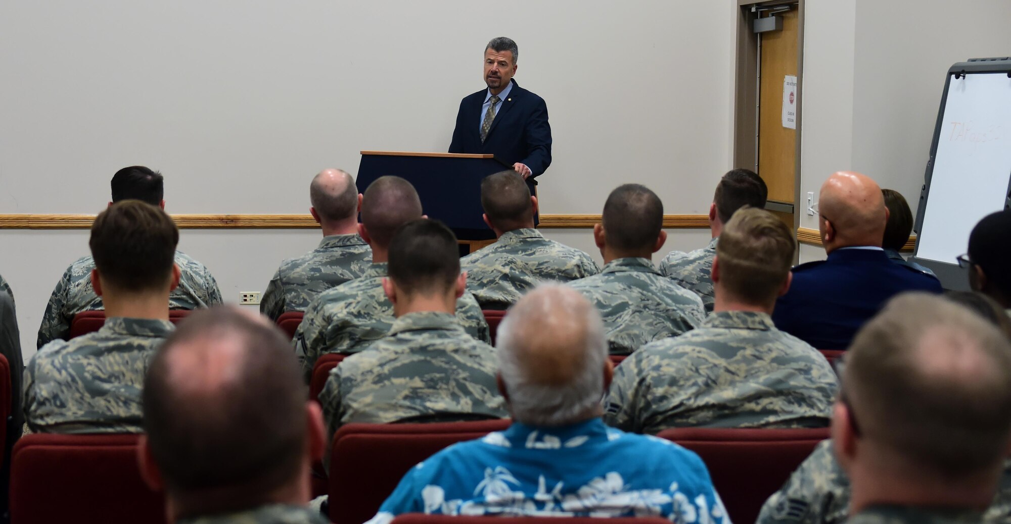 Chief Master Sgt. (ret.) Rene Simard speaks to members of Team Buckley Nov. 10, 2016, at Buckley Air Force Base, Colo. Simard, who previously served as the command chief of Buckley AFB, spoke to service members about both his military and life experiences for Veterans Day. (U.S. Air Force photo by Airman Holden S. Faul/ Released)