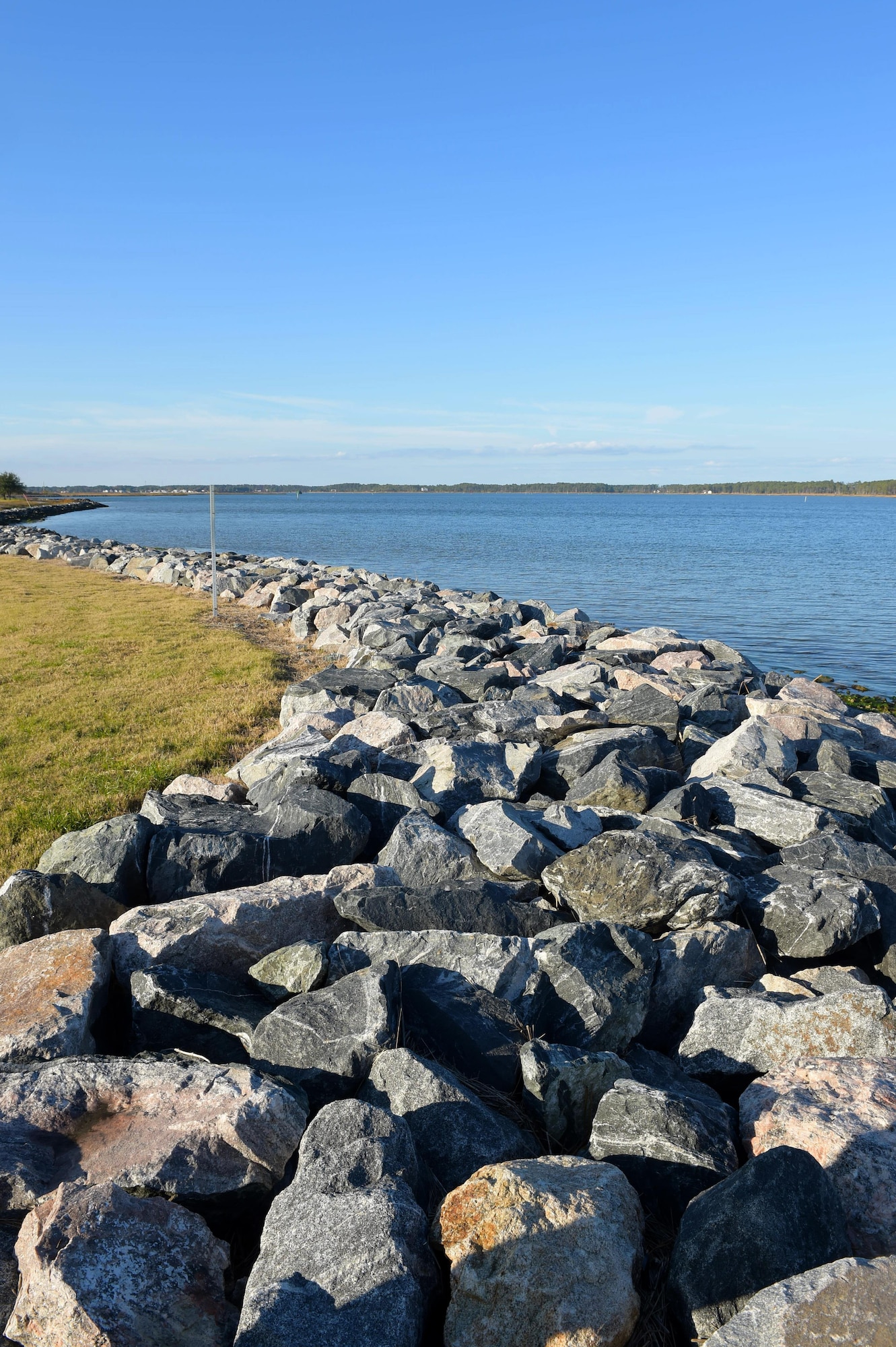 The shoreline stabilization includes a 10 kilometer rip rap sea wall that brings the base’s shore 5.4 feet above sea level. The stabilization also consists of a living shoreline of sea grass that filters sediment and provides a natural habitat for sea life. (U.S. Air Force photo by Senior Airman Kimberly Nagle) 