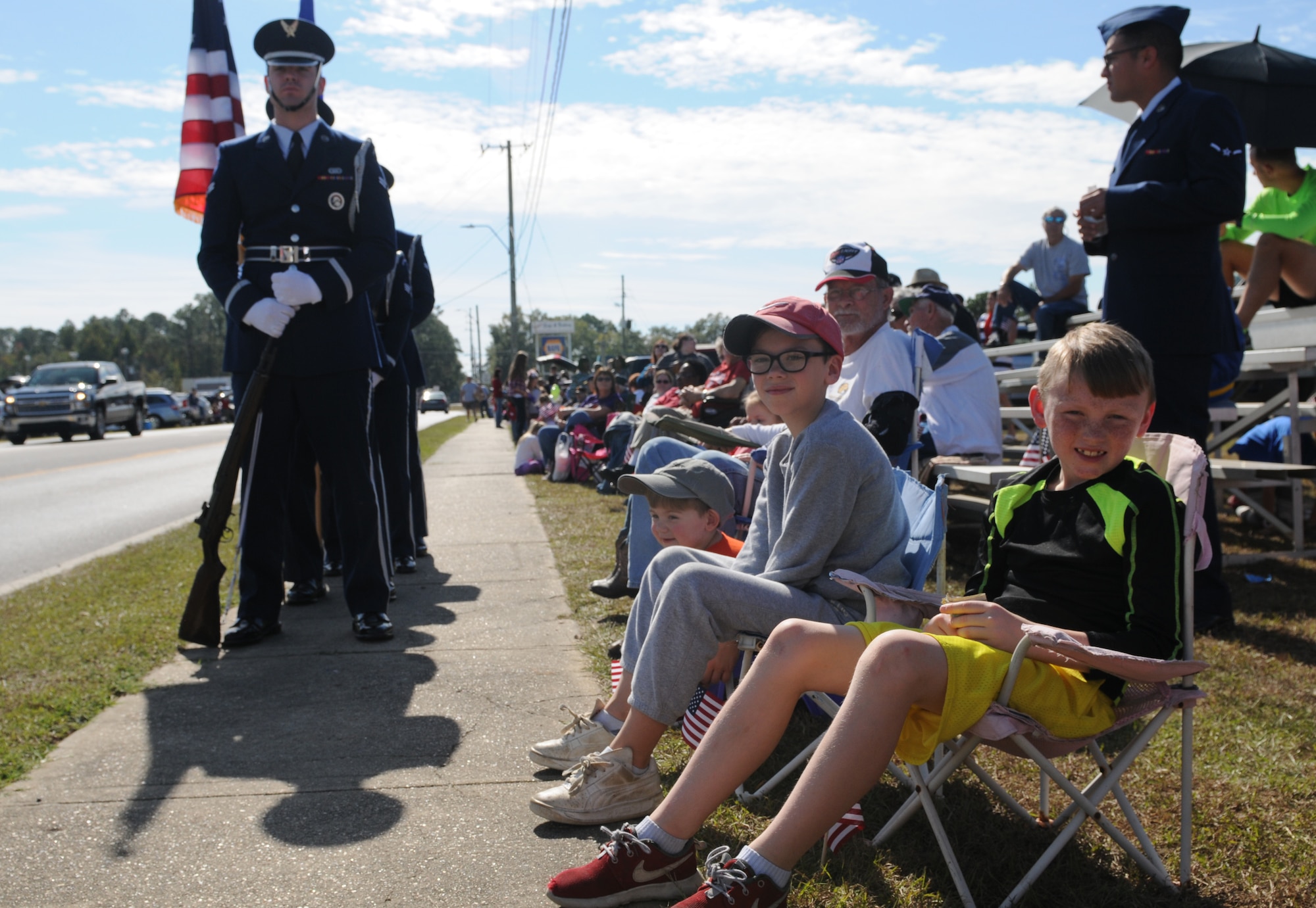 Attendees wait for the 16th Annual Gulf Coast Veterans Day Parade to begin Nov. 12, 2016, in D’Iberville, Miss. More than 5,000 Mississippi and Louisiana citizens watched the parade honoring Gulf Coast veterans. Keesler Honor Guard members, base leadership and more than 215 81st Training Group Airmen with the 50 State Flag Team and Drum and Bugle Corps also came out to celebrate the holiday. (U.S. Air Force photo by Senior Airman Holly Mansfield)