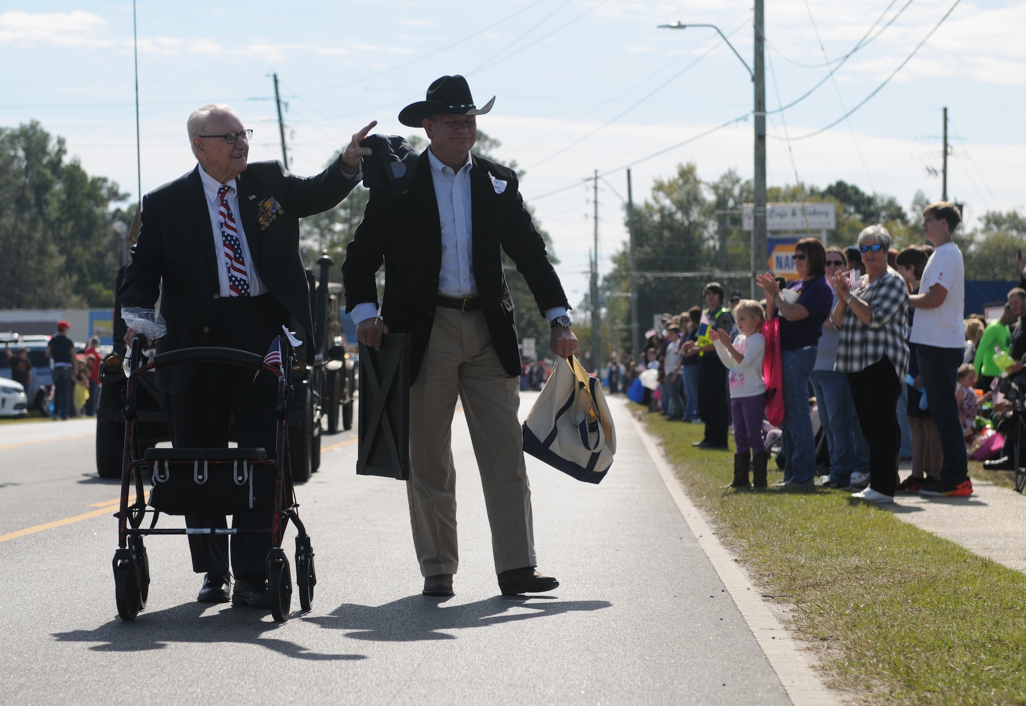 Retired Air Force Lt. Col. Henry Burkle, WW II veteran, arrives as grand marshal at the 16th Annual Gulf Coast Veterans Day Parade Nov. 12, 2016, in D’Iberville, Miss. More than 5,000 Mississippi and Louisiana citizens watched the parade honoring Gulf Coast veterans. Keesler Honor Guard members, base leadership and more than 215 81st Training Group Airmen with the 50 State Flag Team and Drum and Bugle Corps also came out to celebrate the holiday. (U.S. Air Force photo by Senior Airman Holly Mansfield)