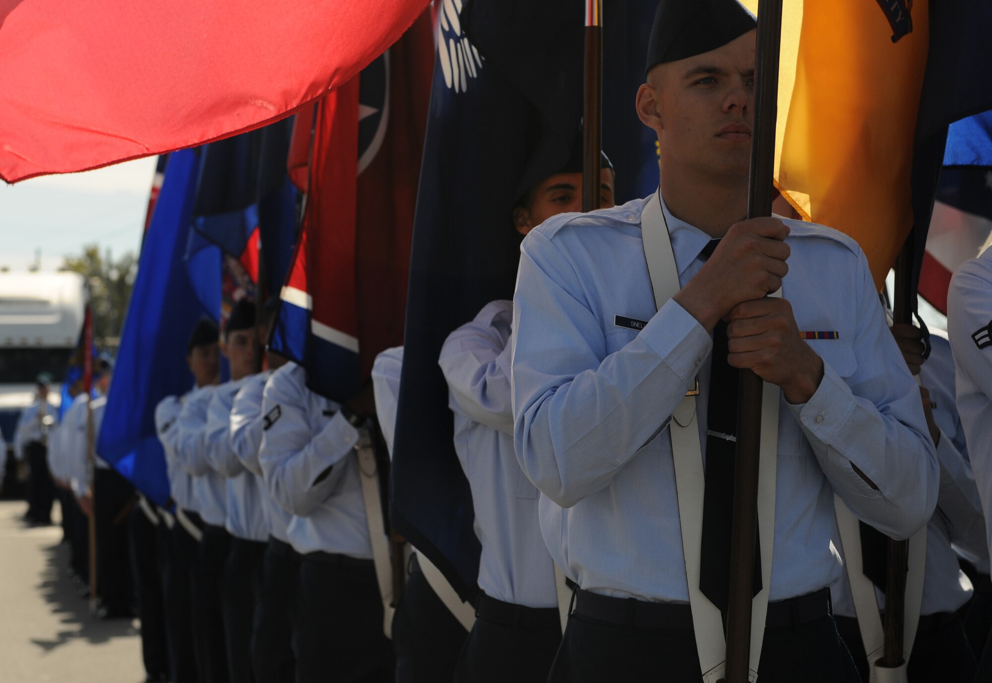 Students from the 81st Training Group march while carrying the 50 state flags in the 16th Annual Gulf Coast Veterans Day Parade Nov. 12, 2016, in D’Iberville, Miss. More than 5,000 Mississippi and Louisiana citizens watched the parade honoring Gulf Coast veterans. Keesler Honor Guard members, base leadership and more than 215 81st TRG Airmen with the 50 State Flag Team and Drum and Bugle Corps also came out to celebrate the holiday. (U.S. Air Force photo by Senior Airman Holly Mansfield)