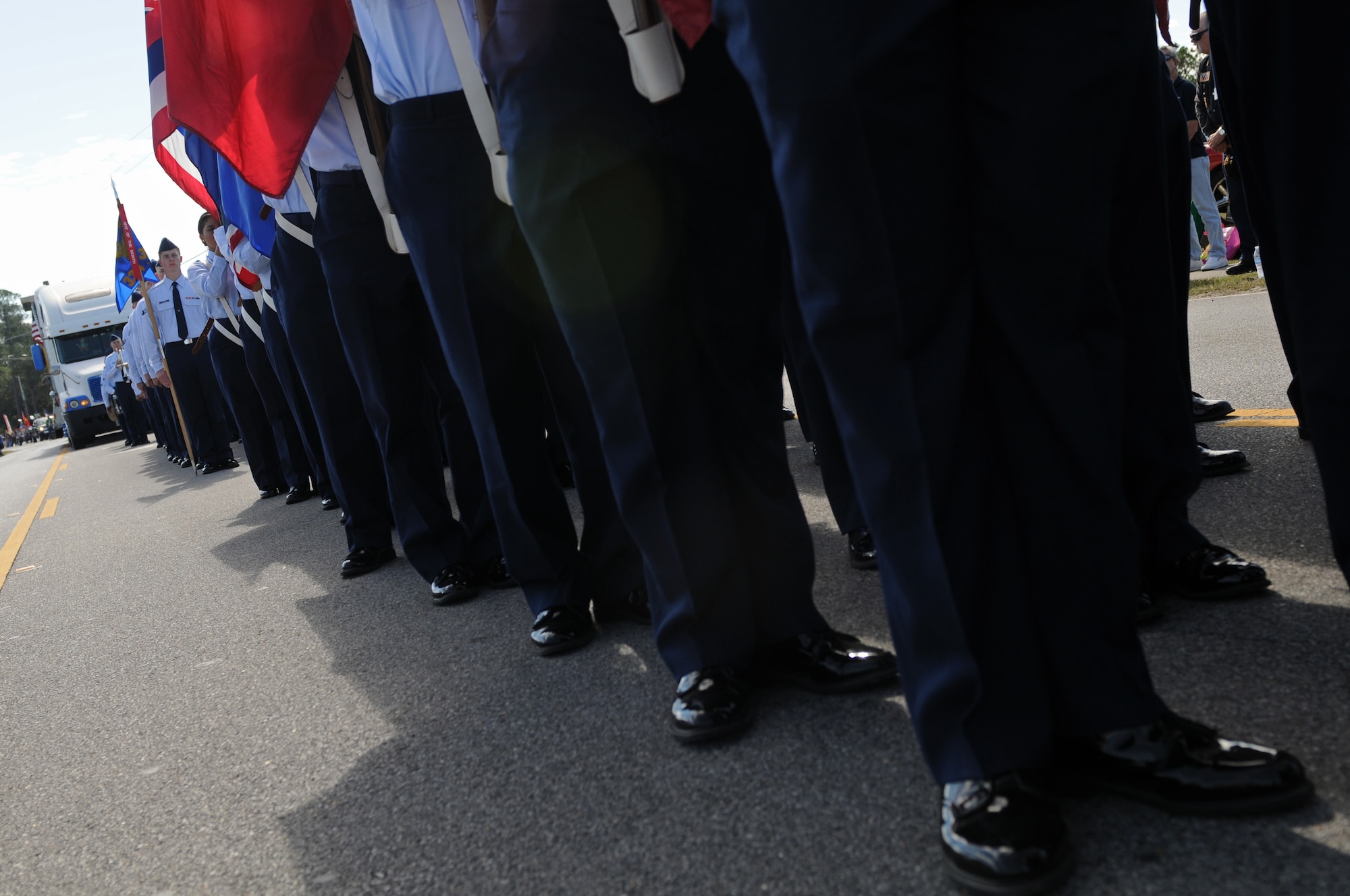 Students from the 81st Training Group march while carrying the 50 state flags in the 16th Annual Gulf Coast Veterans Day Parade Nov. 12, 2016, in D’Iberville, Miss. More than 5,000 Mississippi and Louisiana citizens watched the parade honoring Gulf Coast veterans. Keesler Honor Guard members, base leadership and more than 215 81st TRG Airmen with the 50 State Flag Team and Drum and Bugle Corps also came out to celebrate the holiday. (U.S. Air Force photo by Senior Airman Holly Mansfield)