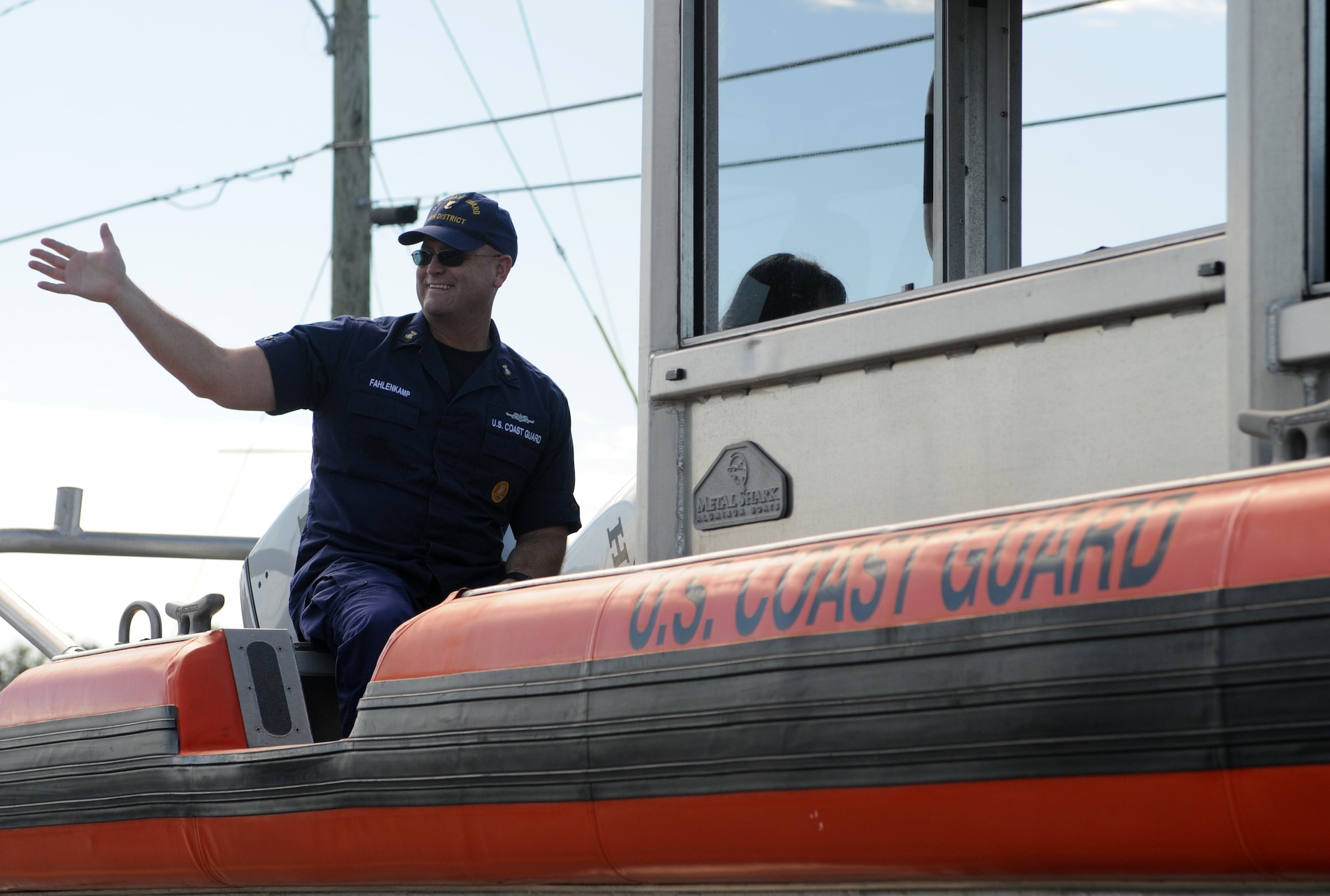 Master Chief Petty Officer Ryan Fahlenkamp, 8th Coast Guard District command master chief, waves to 16th Annual Gulf Coast Veterans Day Parade attendees Nov. 12, 2016, in D’Iberville, Miss. More than 5,000 Mississippi and Louisiana citizens watched the parade honoring Gulf Coast veterans. Keesler Honor Guard members, base leadership and more than 215 81st Training Group Airmen with the 50 State Flag Team and Drum and Bugle Corps also came out to celebrate the holiday. (U.S. Air Force photo by Senior Airman Holly Mansfield)