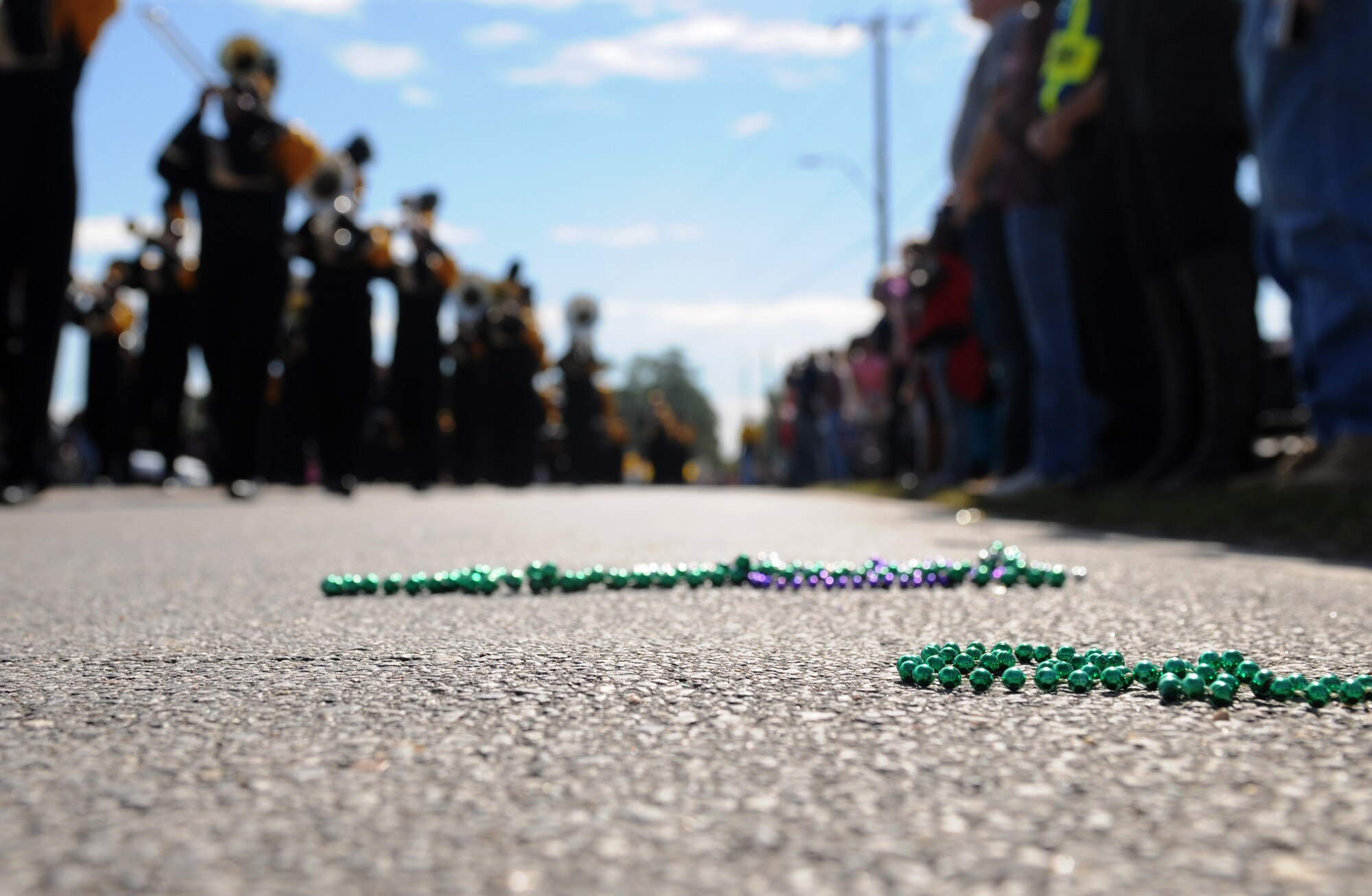 Necklaces lay on the ground at the 16th Annual Gulf Coast Veterans Day Parade Nov. 12, 2016, in D’Iberville. Miss. More than 5,000 Mississippi and Louisiana citizens showed up to participate in the parade to honor Gulf Coast veterans. Keesler Honor Guard members, base leadership and more than 215 81st Training Group Airmen with the 50 State Flag Team and Drum and Bugle Corps also came out to celebrate the holiday. (U.S. Air Force photo by Senior Airman Holly Mansfield)
