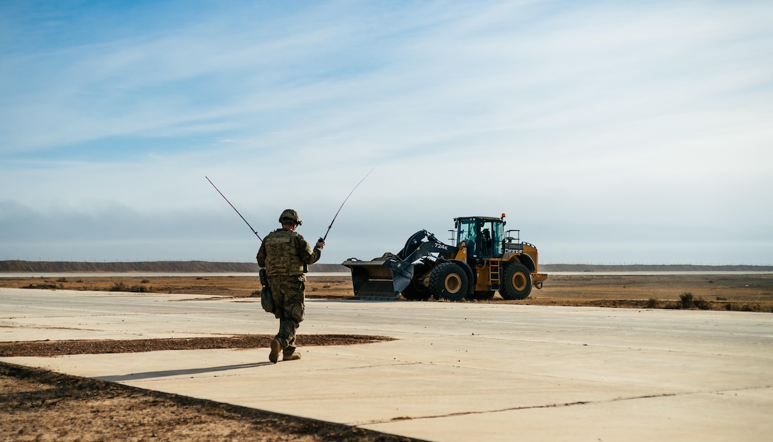 U.S. Air Force Master Sgt. Bradley Rich, 821st Contingency Response Group air traffic controller, prepares to land an Iraqi C-130 at Qayyarah West Airfield, Iraq, in support of Combined Joint Task Force - Operation Inherent Resolve, Nov. 13, 2016. The 821st CRG is actively engaged in tactical airlift operations supporting the Mosul offensive. (U.S. Air Force photo by Senior Airman Jordan Castelan)