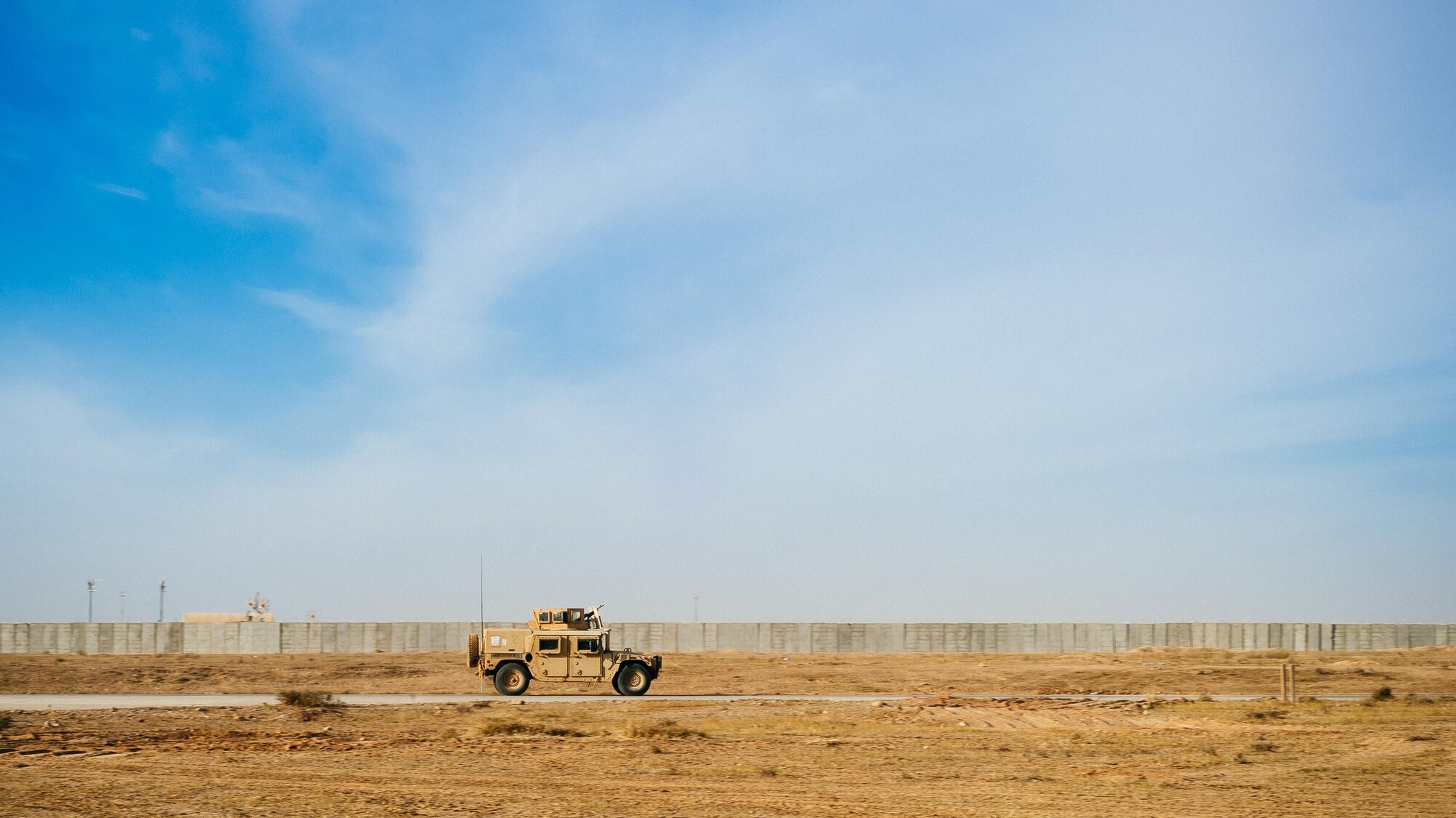 A 821st Contingency Response Group HUMVEE patrols the taxiway at Qayyarah West Airfield, Iraq, in support of Combined Joint Task Force - Operation Inherent Resolve, Nov. 13, 2016. The airfield at Qayyarah West was recaptured from Da’esh by Iraqi forces in July 2016, and has been refurbished by Coalition engineers to allow the re-commencement of air operations. Qayyarah Airfield is now a vital logistical hub, opening an air corridor in support of the battle to liberate Mosul as well as operations throughout northern Iraq. (U.S. Air Force photo by Senior Airman Jordan Castelan)
