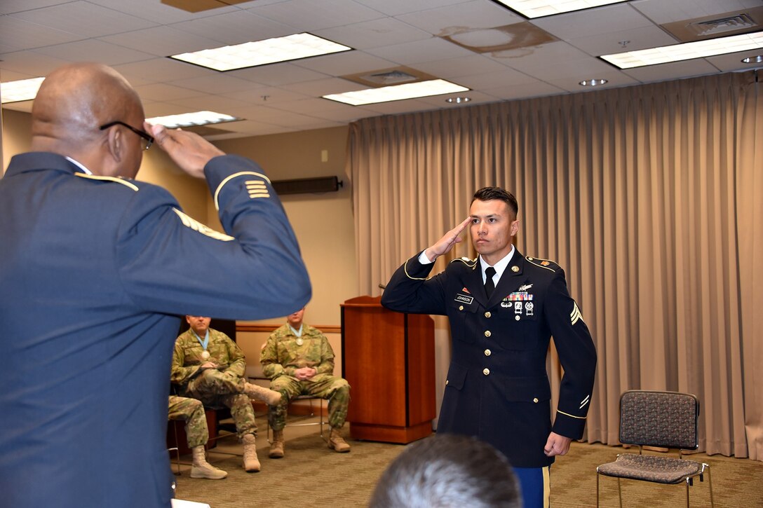 PETERSON AIR FORCE BASE, Colo. -- Candidate Army Sgt. Steven Johnson, Headquarters and Headquarters Company, 53rd Signal Battalion, salutes Command Sgt. Maj. Jerome Wiggins, Sergeant Audie Murphy Club president, during the board for consideration into SAMC at Peterson Air Force Base, Colo., Nov. 3, 2016. Johnson was selected along with another Soldier for induction into the elite group of NCOs who have demonstrated performance and inherent leadership qualities of the group’s namesake. The newly selected SAMC members will receive a certificate and a medallion during an official induction ceremony at a later date. (U.S. Army photo)