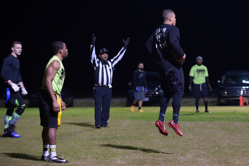 A member from the 497th Intelligence, Surveillance and Reconnaissance Wing team celebrates after scoring during the Intramural Football Championship game at Joint Base Langley-Eustis, Va., Nov. 10, 2016. After competing against several other teams during the season the 497th ISRW made it to championship game to compete for the title. (U.S. Air Force photo by Senior Airman Kimberly Nagle) 