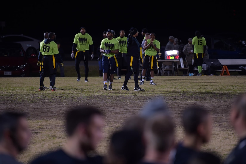 Players from the 497th Intelligence, Surveillance and Reconnaissance Wing team watch as they compete against the team from the Ryan Center during the Intramural Football Championship game at Joint Base Langley-Eustis, Va., Nov. 10, 2016. Team members on the sidelines, cheered and coached the players on the field throughout the game. (U.S. Air Force photo by Senior Airman Kimberly Nagle)