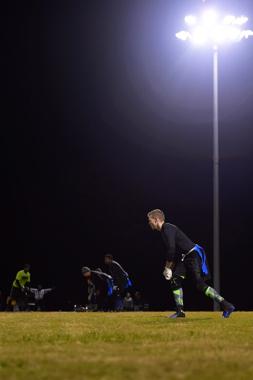 A member of the 497th Intelligence, Surveillance and Reconnaissance Wing team watches the ball during the Intramural Football Championship game at Joint Base Langley-Eustis, Va., Nov. 10, 2016. During the game players rotated in and out to ensure the right players were in the right positions to play the game. (U.S. Air Force photo by Senior Airman Kimberly Nagle)