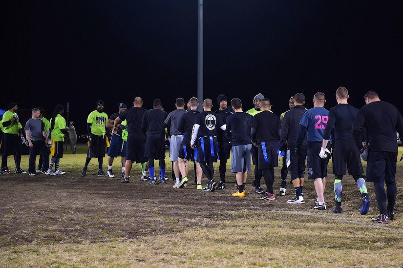 Both teams shake hands at the conclusion of the Intramural Football Championship game at Joint Base Langley-Eustis, Va., Nov. 10, 2016. After competing for more than an hour, the Ryan Center came out on top defeating members of the 497th Intelligence, Surveillance and Reconnaissance Wing. (U.S. Air Force photo by Senior Airman Kimberly Nagle)