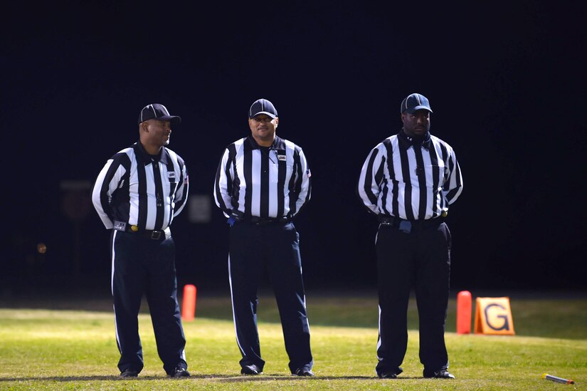 Referees talk before the Intramural Football Championship game at Joint Base Langley-Eustis, Va., Nov. 10, 2016. The referees ensured a safe and fair game between the two competing teams. (U.S. Air Force photo by Senior Airman Kimberly Nagle)
