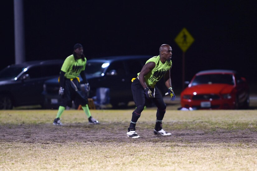 Members of the Ryan Center football team prepare for a play during the Intramural Football Championship game at Joint Base Langley-Eustis, Va., Nov. 10, 2016. The Ryan Center team, a multiple championship playing team, won this year’s final game. (U.S. Air Force photo by Senior Airman Kimberly Nagle) 