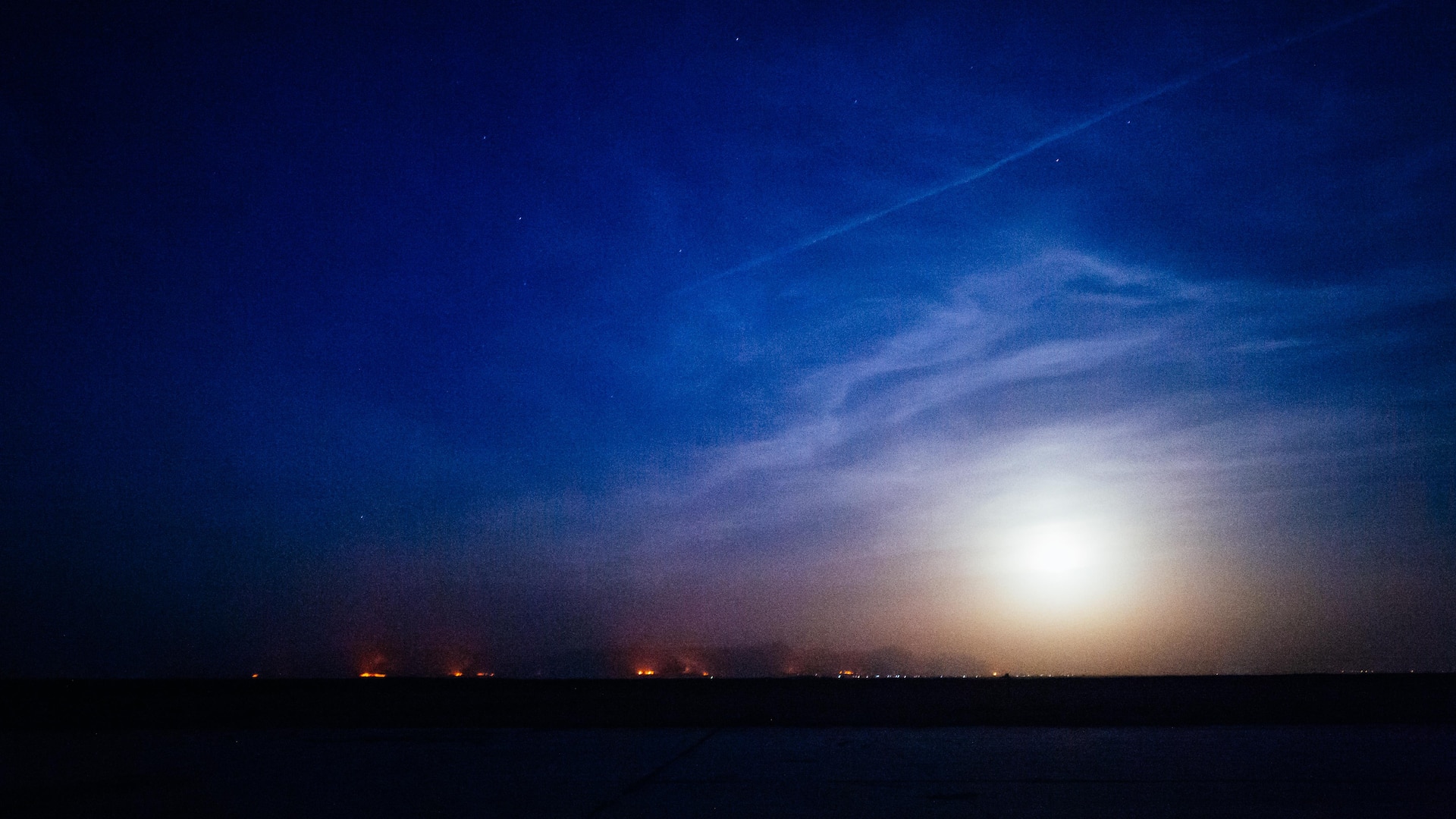 Oil fires burn along the eastern horizon near Qayyarah West Airfield, Iraq, Nov. 14, 2016. The airfield at Qayyarah West was recaptured from Da’esh by Iraqi forces in July 2016, and has been refurbished by Coalition engineers to allow the re-commencement of air operations. Qayyarah Airfield is now a vital logistical hub, opening an air corridor in support of the battle to liberate Mosul as well as operations throughout northern Iraq. (U.S. Air Force photo by Senior Airman Jordan Castelan)