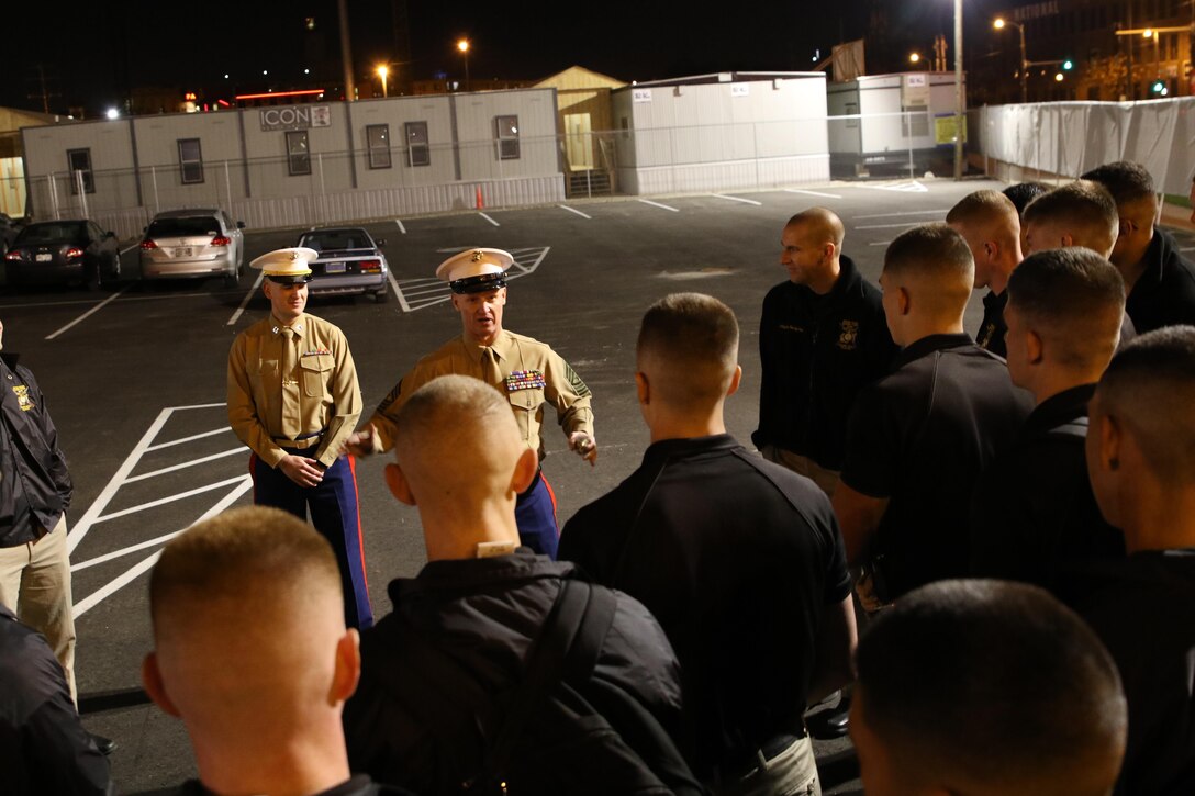 Sgt. Maj. Jason F. Wolken, the sergeant major of Recruiting Station Milwaukee, speaks with members of the Silent Drill Platoon prior to their performance at the Milwaukee Bucks game in downtown Milwaukee, Nov. 10, 2016. The platoon came to Milwaukee to demonstrate the precision and discipline that the Marine Corps is known across the world for having. This helps the efforts of the local recruiting station such as the one in Milwaukee, which is responsible for Marine Corps recruiting throughout Wisconsin. 