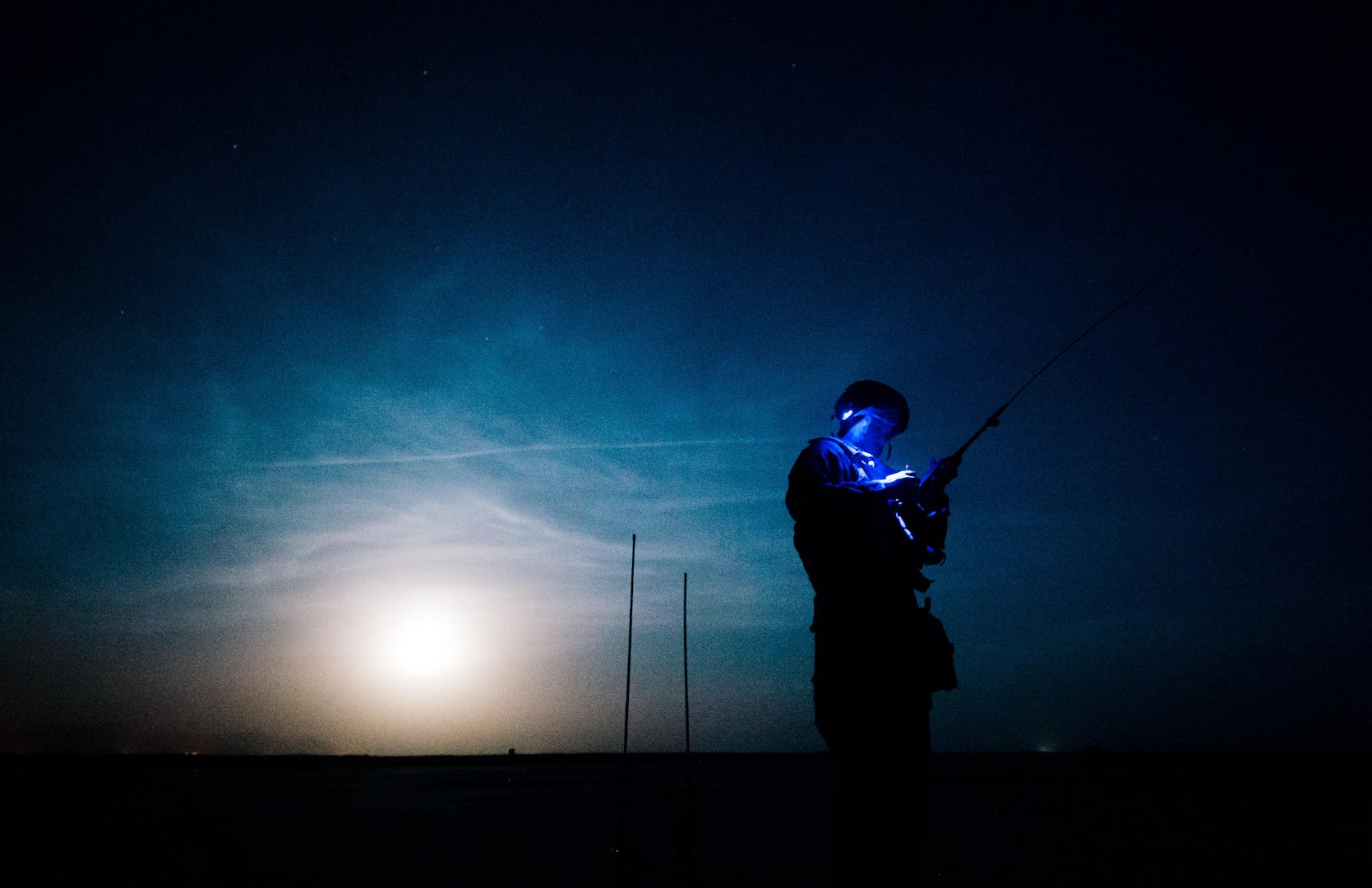 U.S. Air Force Master Sgt. Greylynn Carr, 821st Contingency Response Group air traffic controller, prepares for an arriving C-130 at Qayyarah West Airfield, Iraq, in support of Combined Joint Task Force - Operation Inherent Resolve, Nov. 14, 2016. The 821st CRG is highly-specialized in training and rapidly deploying personnel to quickly open airfields and establish, expand, sustain and coordinate air operations in austere, bare-base conditions. (U.S. Air Force photo by Senior Airman Jordan Castelan)