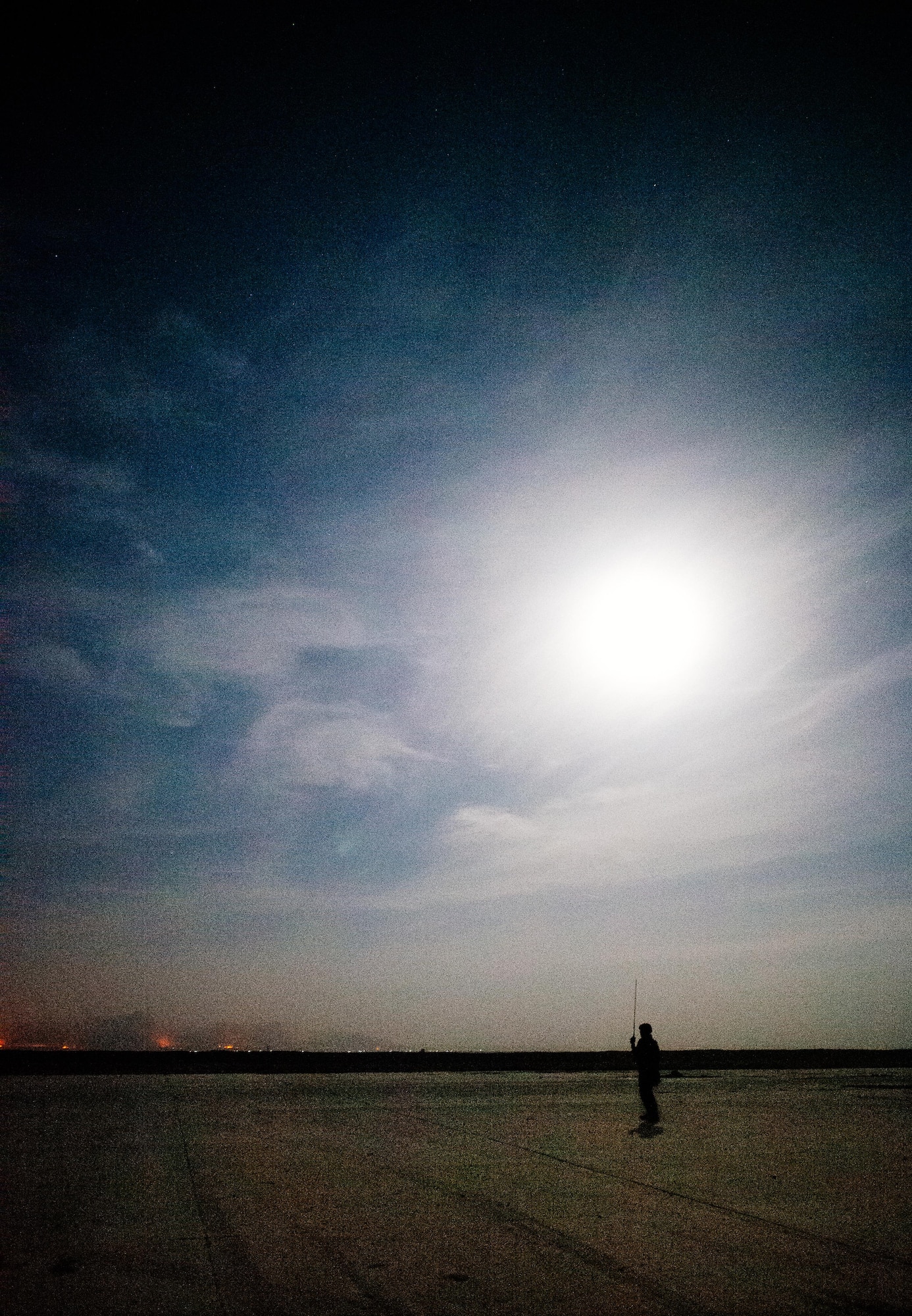 U.S. Air Force Staff Sgt. Steven Ramos, 821st Contingency Response Group airfield manager, prepares for an arriving C-130 at Qayyarah West Airfield, Iraq, in support of Combined Joint Task Force - Operation Inherent Resolve, Nov. 14, 2016. The airfield at Qayyarah West was recaptured from Da’esh by Iraqi forces in July 2016, and has been refurbished by Coalition engineers to allow the re-commencement of air operations. Qayyarah Airfield is now a vital logistical hub, opening an air corridor in support of the battle to liberate Mosul as well as operations throughout northern Iraq. (U.S. Air Force photo by Senior Airman Jordan Castelan)