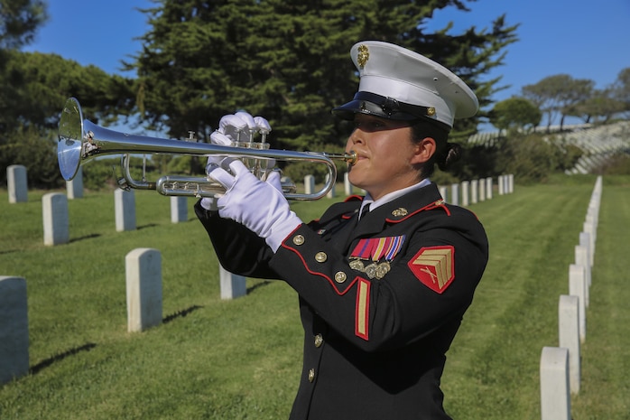 A  Marine trumpet player from the Marine Corps Recruit Depot San Diego Band, plays taps during a wreath laying ceremony Nov. 10. A wreath was placed on the grave of Leland D. Crawford, the ninth sergeant major of the Marine Corps. Marines place wreaths to honor fallen comrades and in celebration of the Marine Corps’ 241st birthday, which is Nov. 10, 1775.