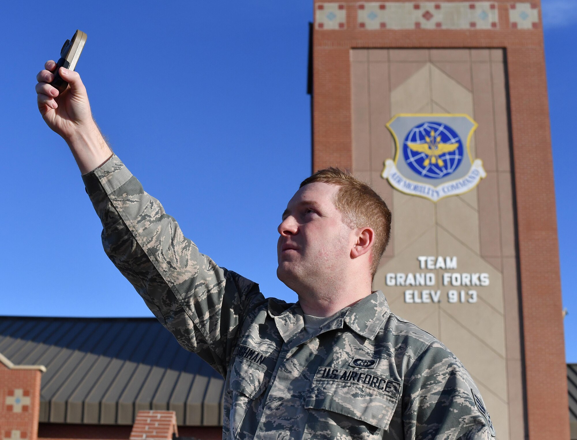 Senior Airman Jordan Baughman, 319th Operations Support Squadron weather flight forecaster, uses a weather and wind measuring device called a Kestrel meter for weather observation on Grand Forks Air Force Base, N.D. Nov. 15, 2016. Baughman was named Air Mobility Command’s Weather Airman of the Year. (U.S. Air Force photo by Airman 1st Class Elijaih Tiggs)
