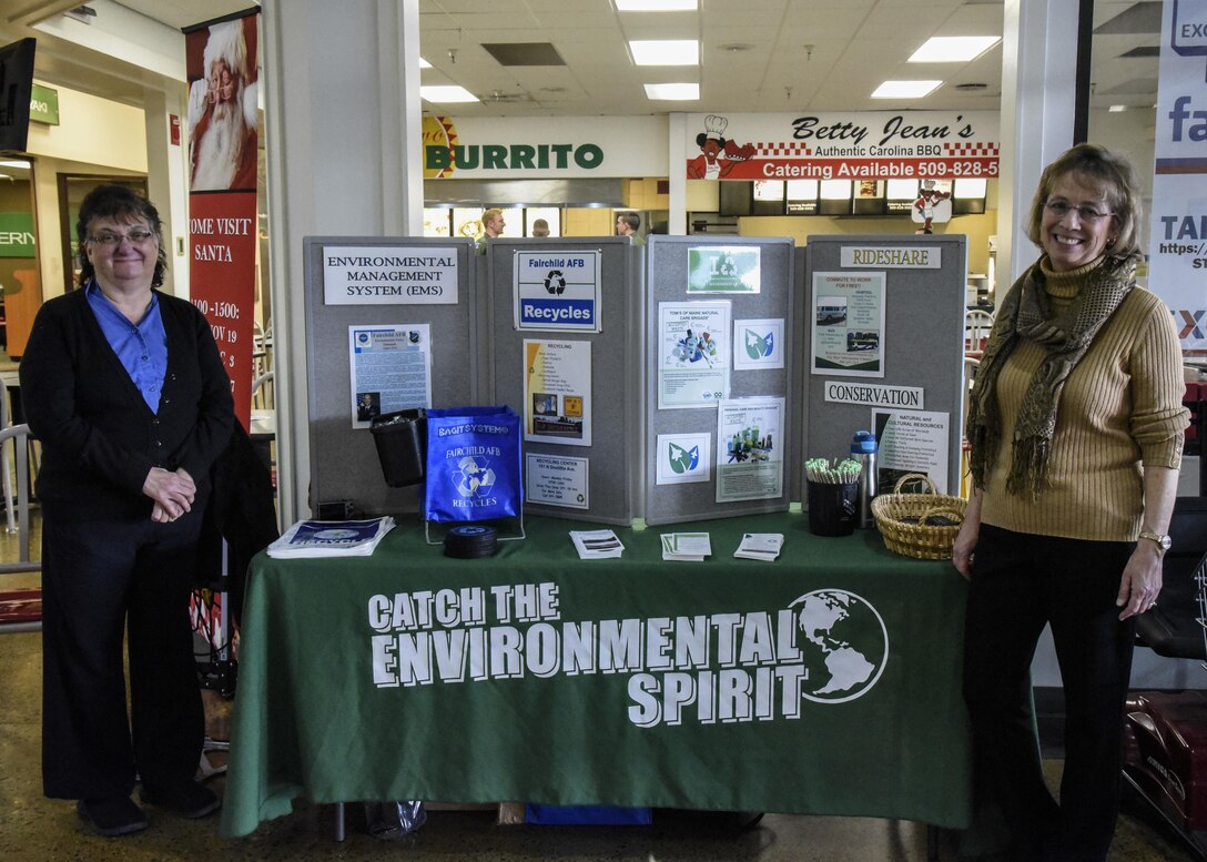 Georgia Allen, Balfour Beatty lifeworks coordinator, and Diane Wulf, 92nd Civil Engineer Squadron pollution prevention program manager, talk about a recycling brochure during National Recycling Day Nov. 15, 2016, at Fairchild Air Force Base, Wash. Recycling is more than just separating paper out of the trash can and into the iconic “blue bin.” Recycling is about conserving natural resources and buying those recycled items back. “After items are put into the blue bin, they are delivered to a recycling facility and some recyclables are sold off to a manufacturer to be made into something new,” said Wulf. (U.S. Air Force photo/Airman 1st Class Taylor Shelton)