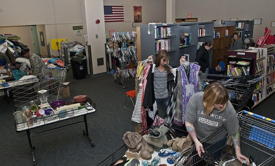 Airman’s Attic volunteers arrange items at Minot Air Force Base, N.D., Oct. 31, 2016. The Airman’s Attic is a nonprofit self-servicing thrift store open to all military members and their dependents. (U.S. Air Force photo/Airman 1st Class Jonathan McElderry)