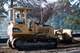 William McElveen, contracted heavy equipment operator, uses a bulldozer to push and compress soil so grass can be planted near the Main Gate at Shaw Air Force Base, S.C., Nov. 16, 2016. The construction will provide parking spaces and walking paths to improve visitor access to the air park. (U.S. Air Force photo by Airman 1st Class Kathryn R.C. Reaves)