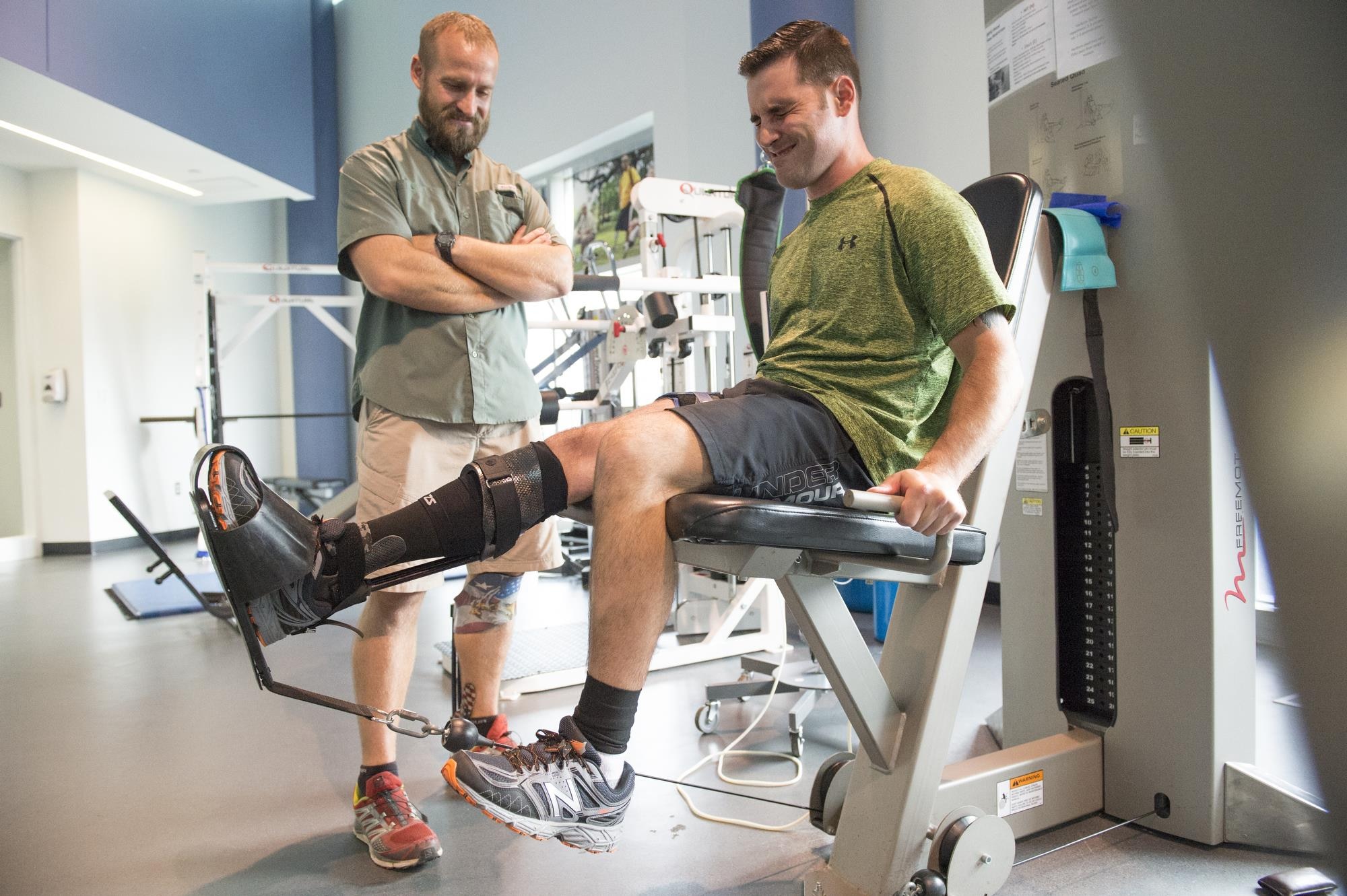 Wayne Strube, a former Air Force security forces patrolman, coaches Army Staff Sgt. Lennis Lebarge as he rehabs his right knee with the Delfi machines BFR tourniquet at the Center for the Intrepid at Fort Sam Houston, Texas, Sept. 13, 2016. The BFR tourniquet reduces blood flowing from the specific body part and expedites the healing process. Strube currently serves military service members as the CFI physical therapist in charge of the Return to Run program at San Antonio Medical Center, Texas. The CFI Return to Run program is currently servicing active-duty service members and some civilians that have been injured in accidents. (U.S. Air Force photo/Tech Sgt. Vernon Young Jr.)