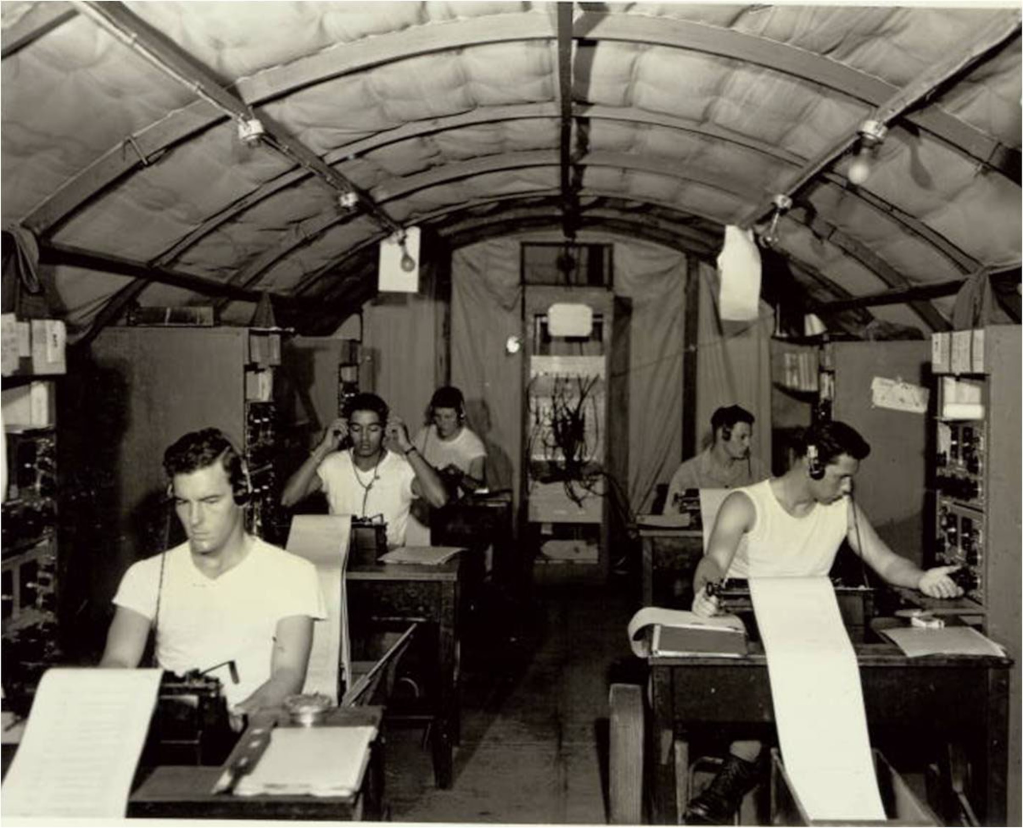 Morse operators conduct intercept activities at Detachment 4 of the 1st Radio Squadron Mobile in 1953.
