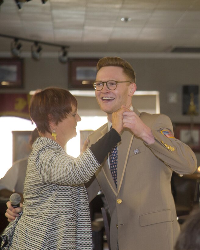 Maxine MacDonald, warehouse materials operations officer, dances with one of the performers from the USO Show Troupe during their show aboard Marine Corps Logistics Base Barstow, Calif., Nov. 12. 