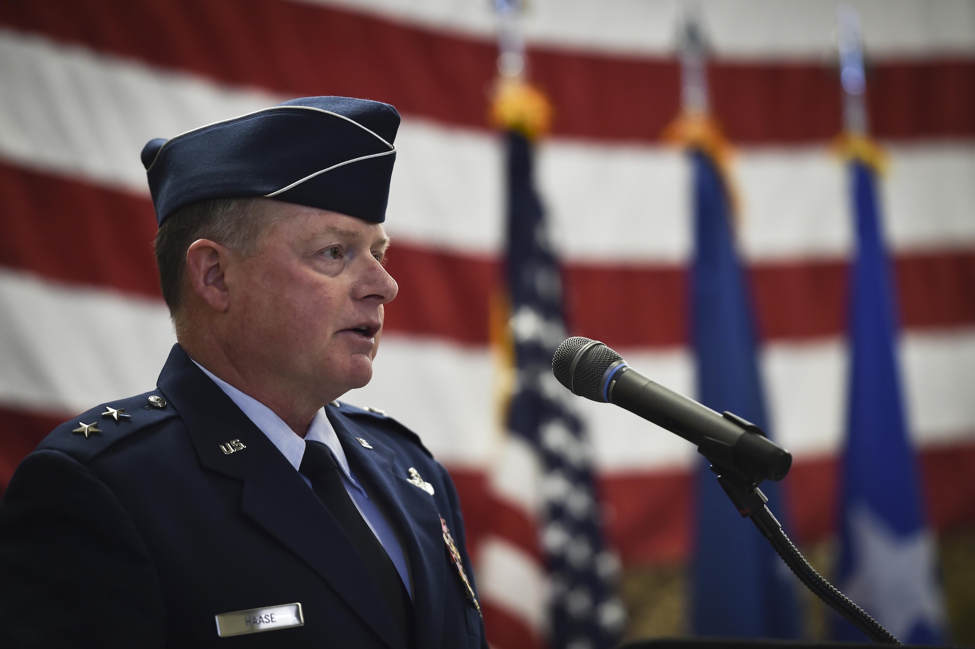 Maj. Gen. Eugene Haase, vice commander of Air Force Special Operations Command, speaks during a Silver Star Medal presentation ceremony for Staff Sgt. Keaton Thiem, a combat controller, at Joint Base Lewis-McChord, Wash., Nov. 16, 2016. Thiem used air power to ensure the safety of his 100-plus man SOF element during a 14-hour firefight with no regard for his own personal safety, while deployed with U.S. Army Special Operations Forces in Afghanistan. (U.S. Air Force photo by Senior Airman Ryan Conroy)