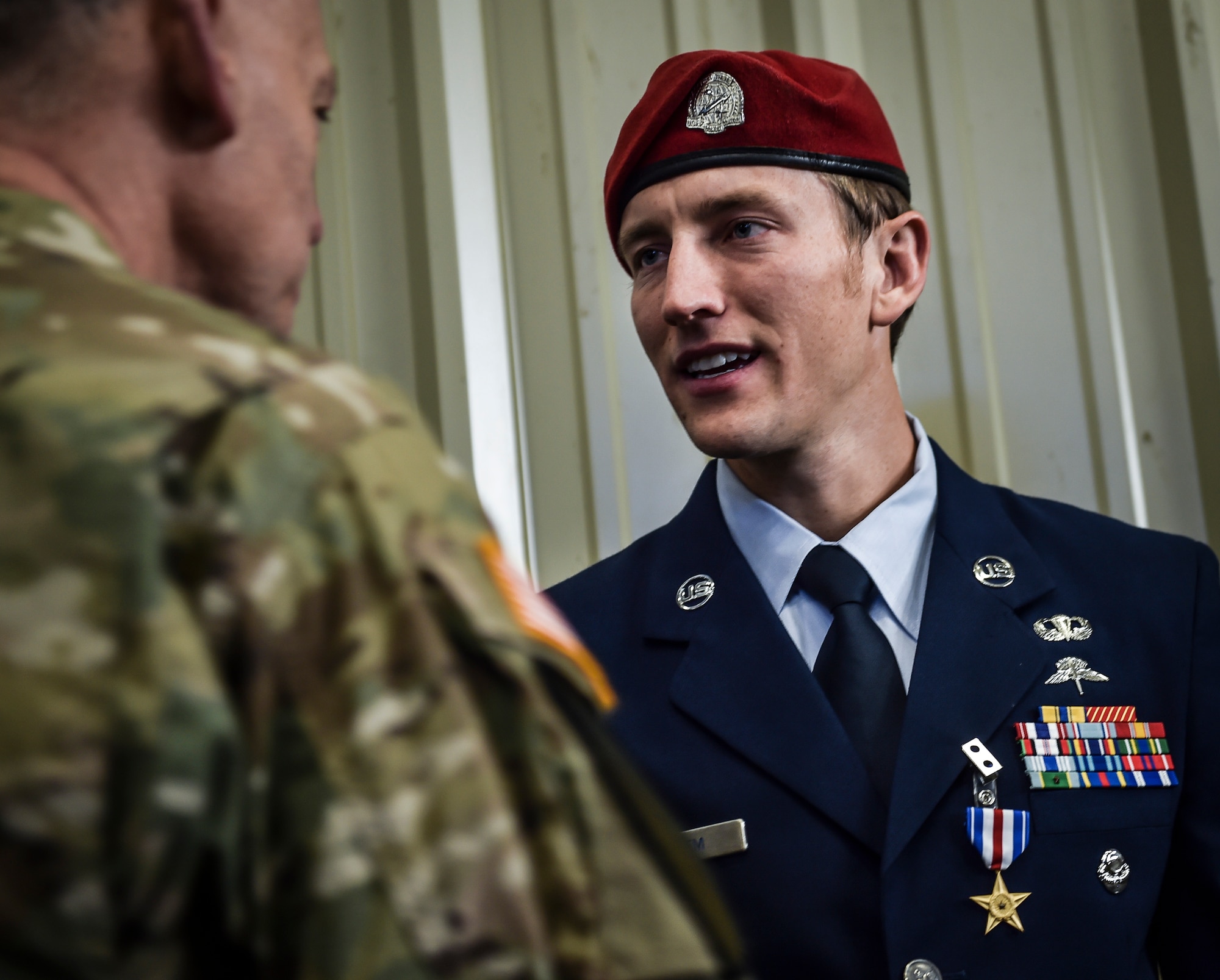 Staff Sgt. Keaton Thiem, a combat controller with the 22nd Special Tactics Squadron, shakes hands with visitors following his Silver Star Medal presentation ceremony at Joint Base Lewis-McChord, Wash., Nov. 16, 2016. Thiem used air power to ensure the safety of his 100-plus man SOF element during a 14-hour firefight with no regard for his own personal safety, while deployed with U.S. Army Special Operations Forces in Afghanistan. (U.S. Air Force photo by Senior Airman Ryan Conroy) 